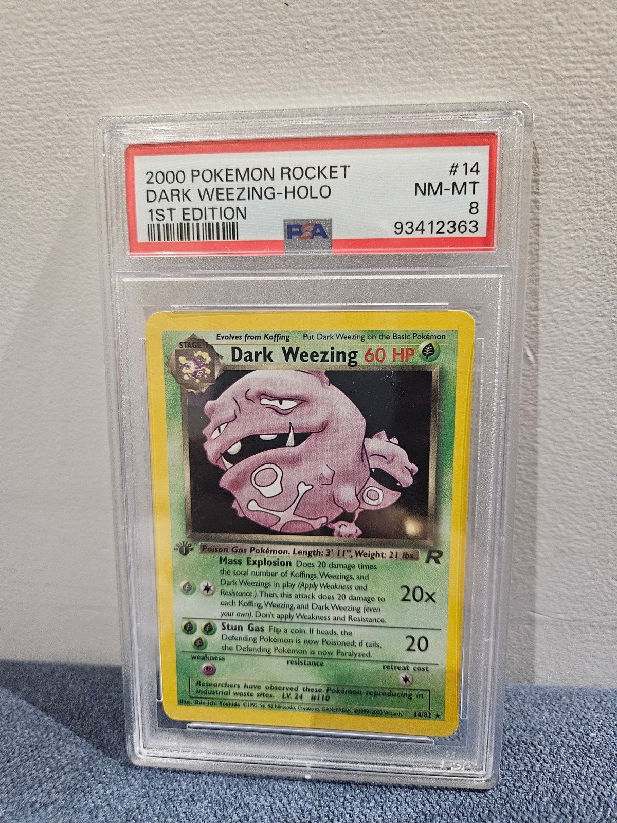 Pokémon Dark Weezing Holo 1st Edition PSA 8, Ophalen of Verzenden, Zo goed als nieuw, Losse kaart, Foil