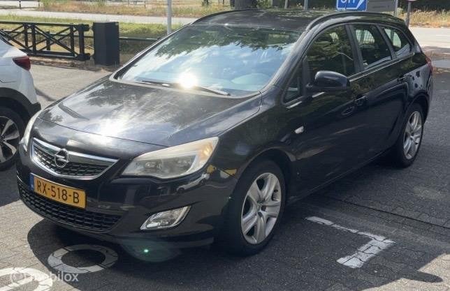 Opel Astra Sports Tourer 1.4 Cosmo, Auto's, Voorwielaandrijving, Euro 5, 101 pk, Gebruikt