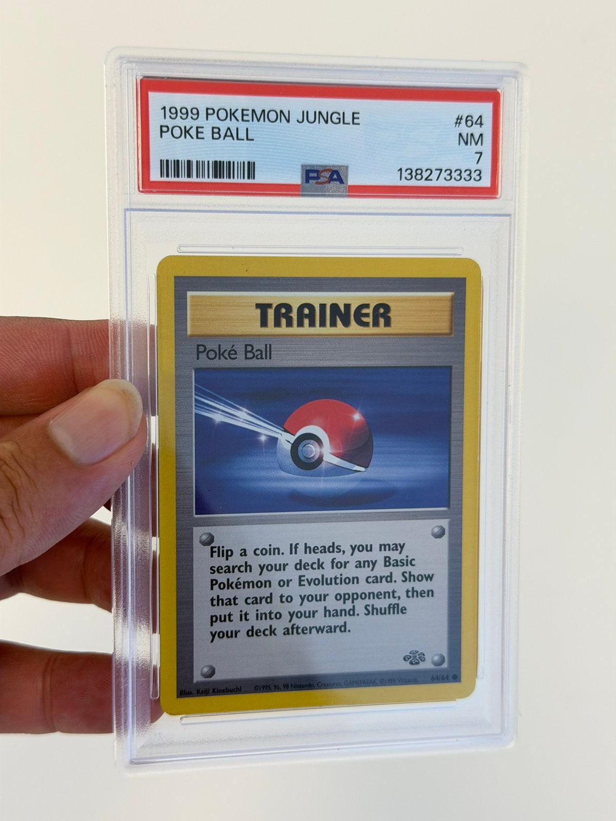 1999 Pokémon Poké Ball 64/64 Jungle PSA 7 Vintage WOTC #64, Hobby en Vrije tijd, Ophalen of Verzenden, Zo goed als nieuw, Losse kaart