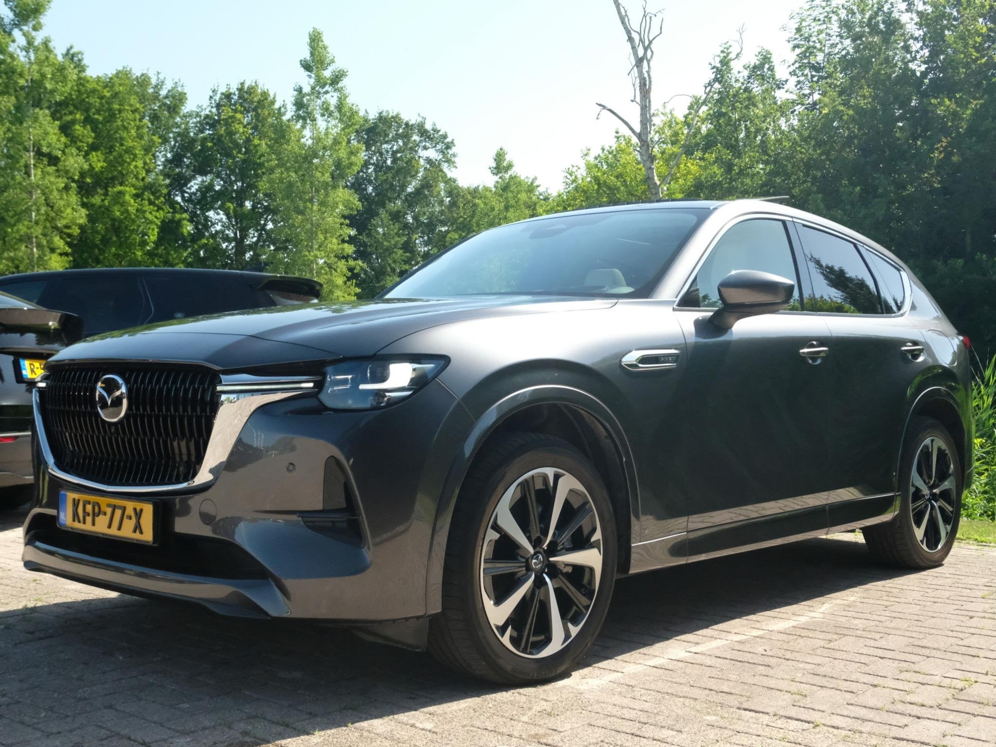 Mazda CX-60 2.5 e-SkyActiv PHEV Takumi 328 PK | Wegklapbare, Auto's, Automaat, Stof, Gebruikt, 2500 kg