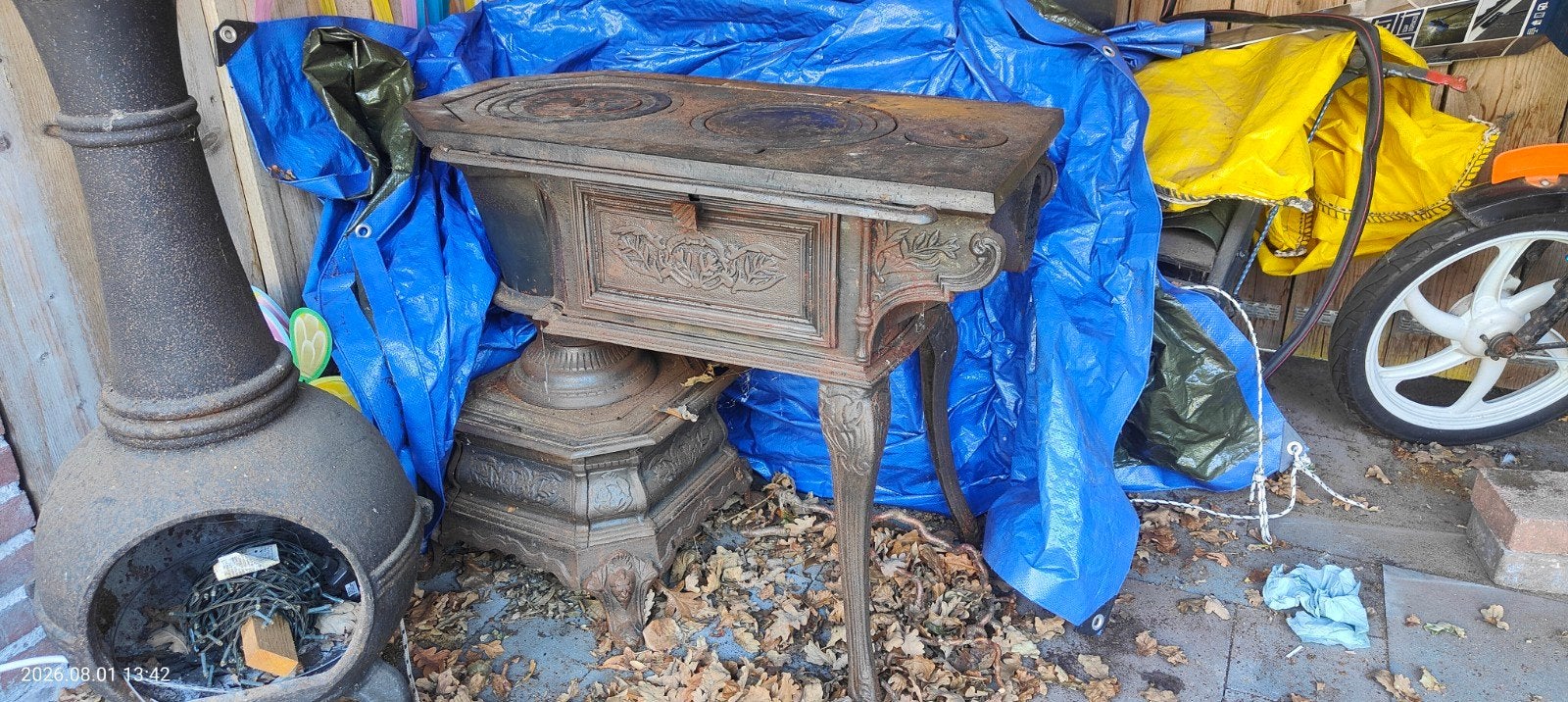 oude gietijzeren hout kachel, Ophalen