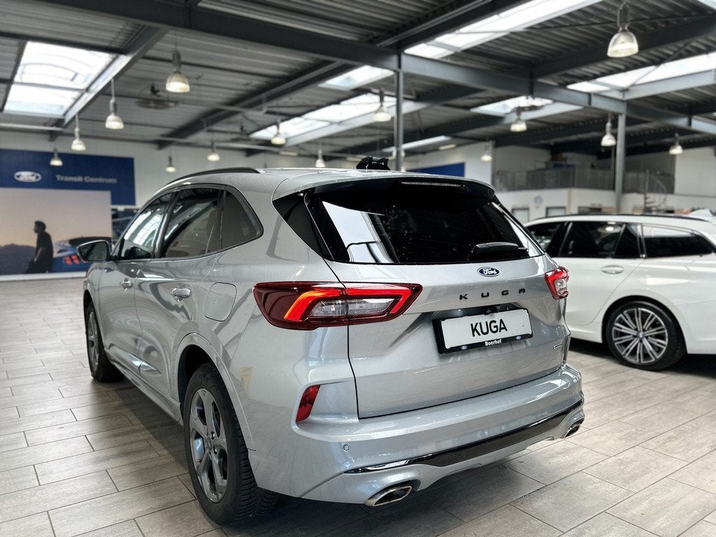 Ford Kuga 2.5 PHEV 243 pk ST-Line X I AGR stoelen | Adapt Cr, Auto's, Ford, 12 maanden, 14 kWh, Gebruikt, Zwart