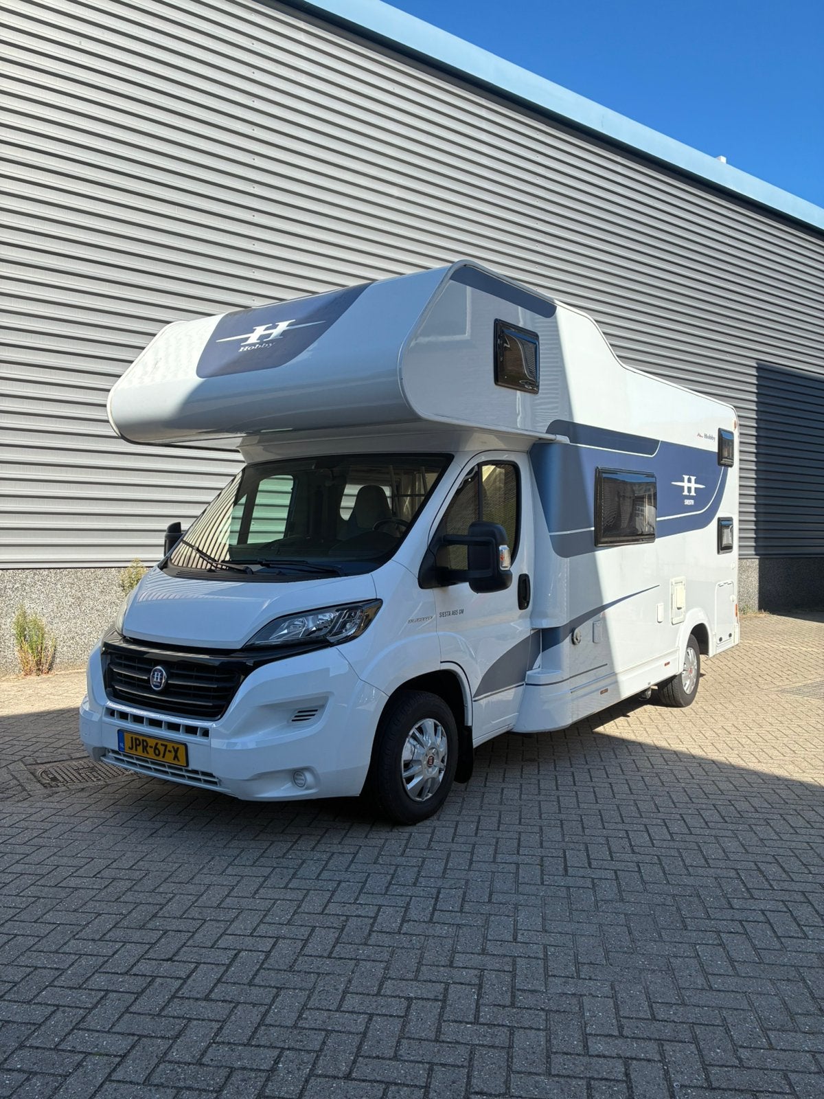 Hobby 65 GM siesta 6 persoon alkoof camper, Caravans en Kamperen, Bedrijf, Half-integraal, Hobby