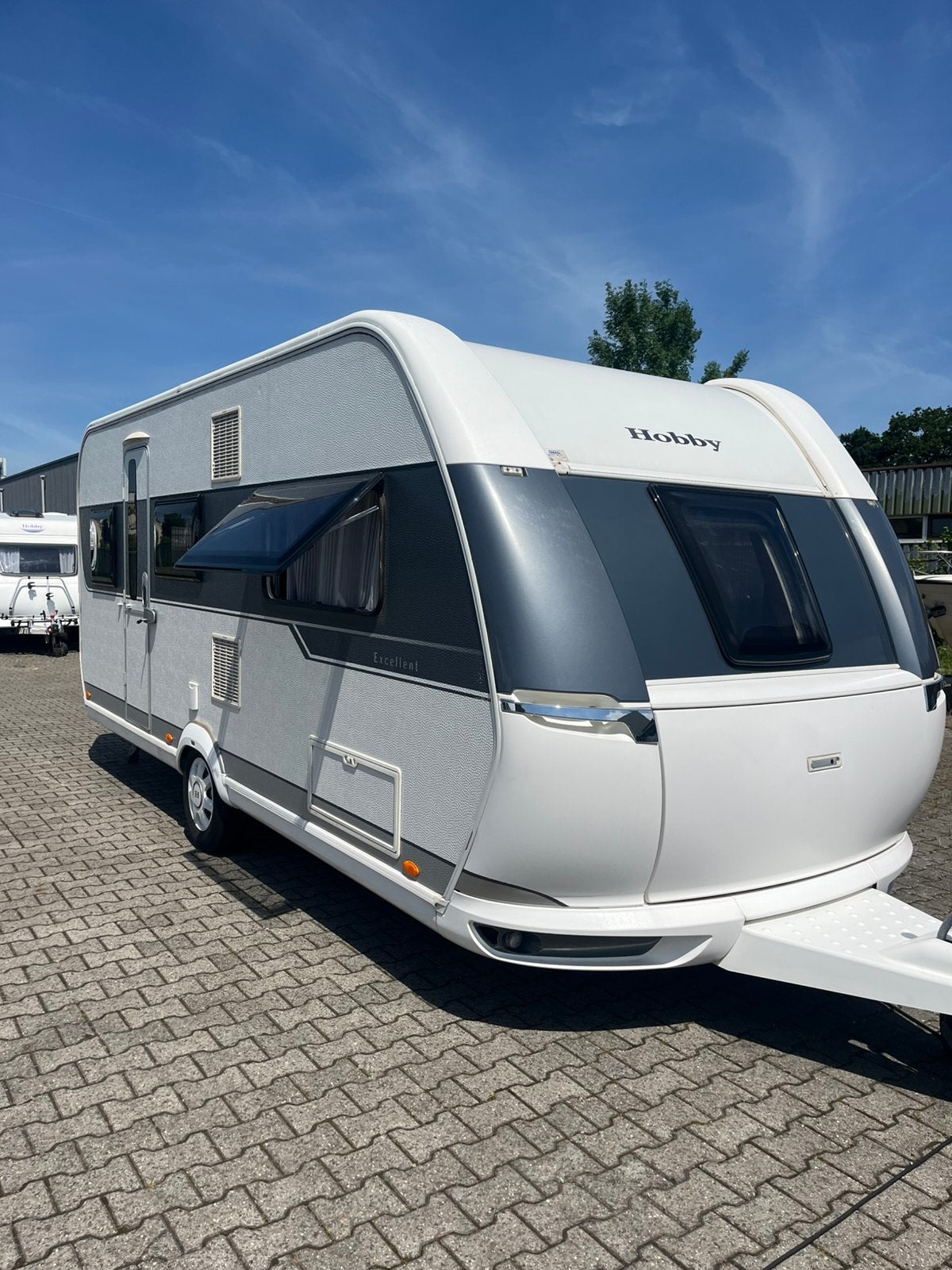 Nette hobby 495 UL! Met enkele bedden, luchtvoortent! Bovag!, Caravans en Kamperen, Schokbreker, Rondzit, Hobby, Bedrijf