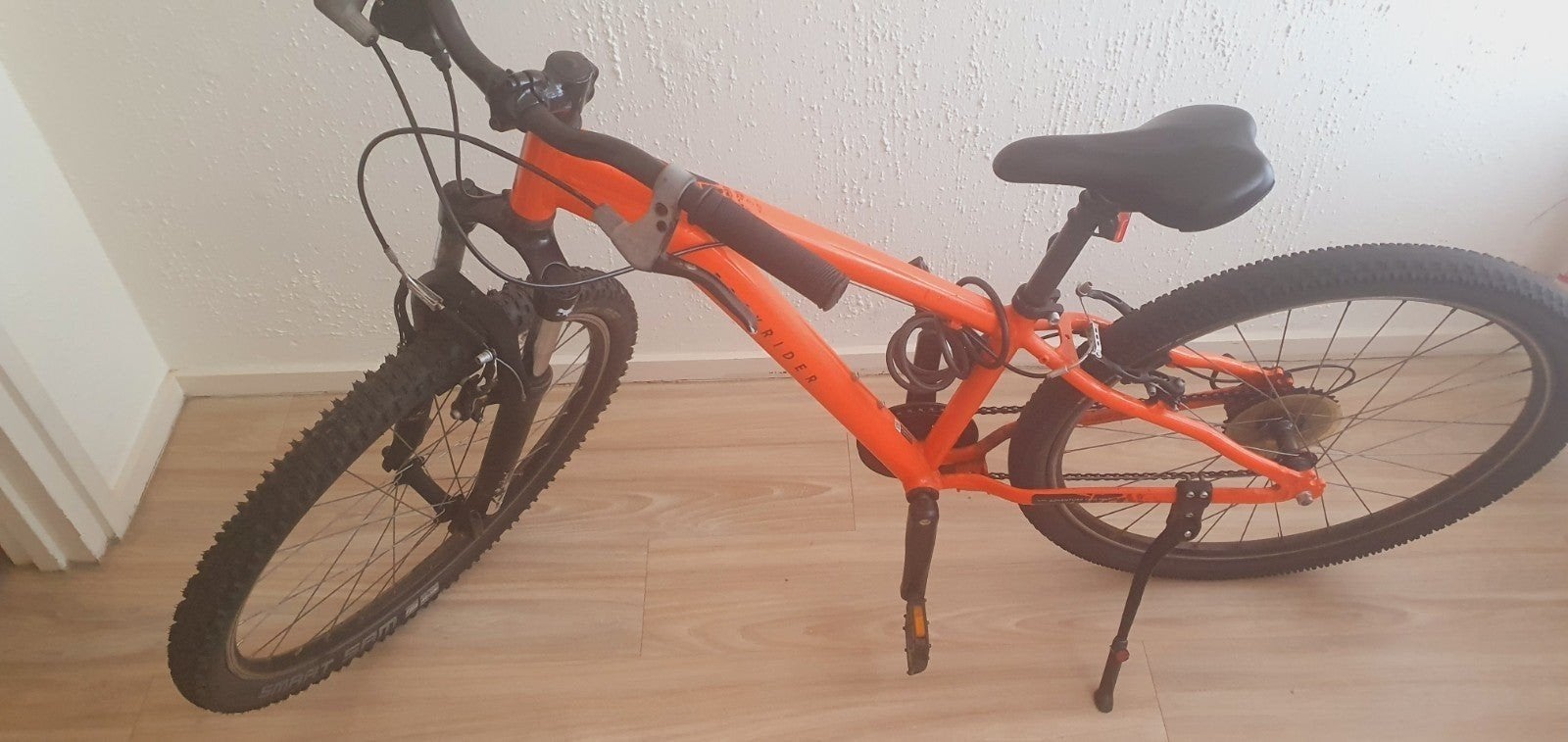 Oranje Rockrider mountainbike, Gebruikt, Velgrem, Versnellingen, 53 tot 57 cm