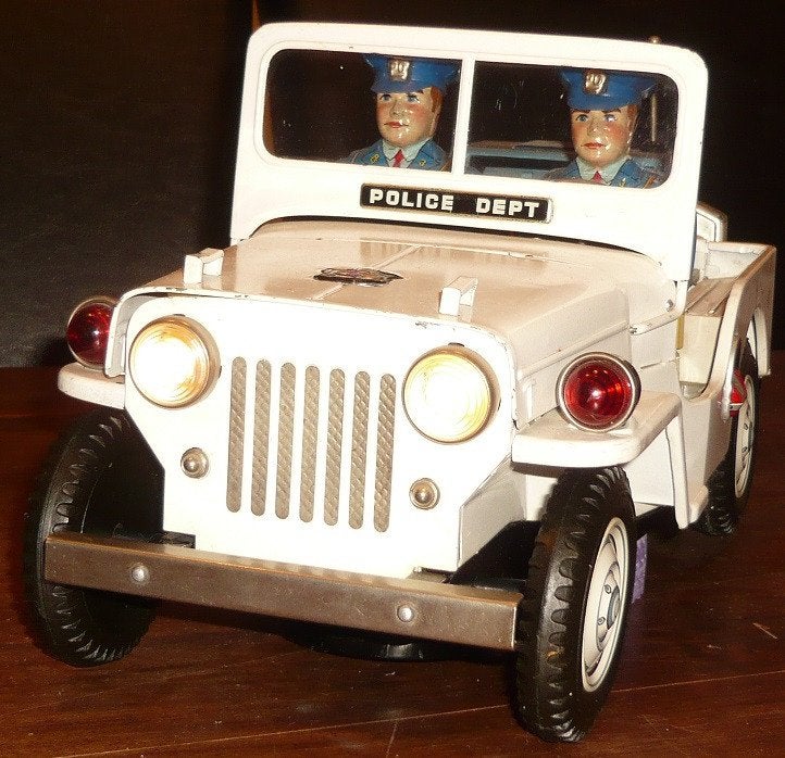 TN Nomura jeep police dept batt. operated japanese tintoy, Ophalen of Verzenden