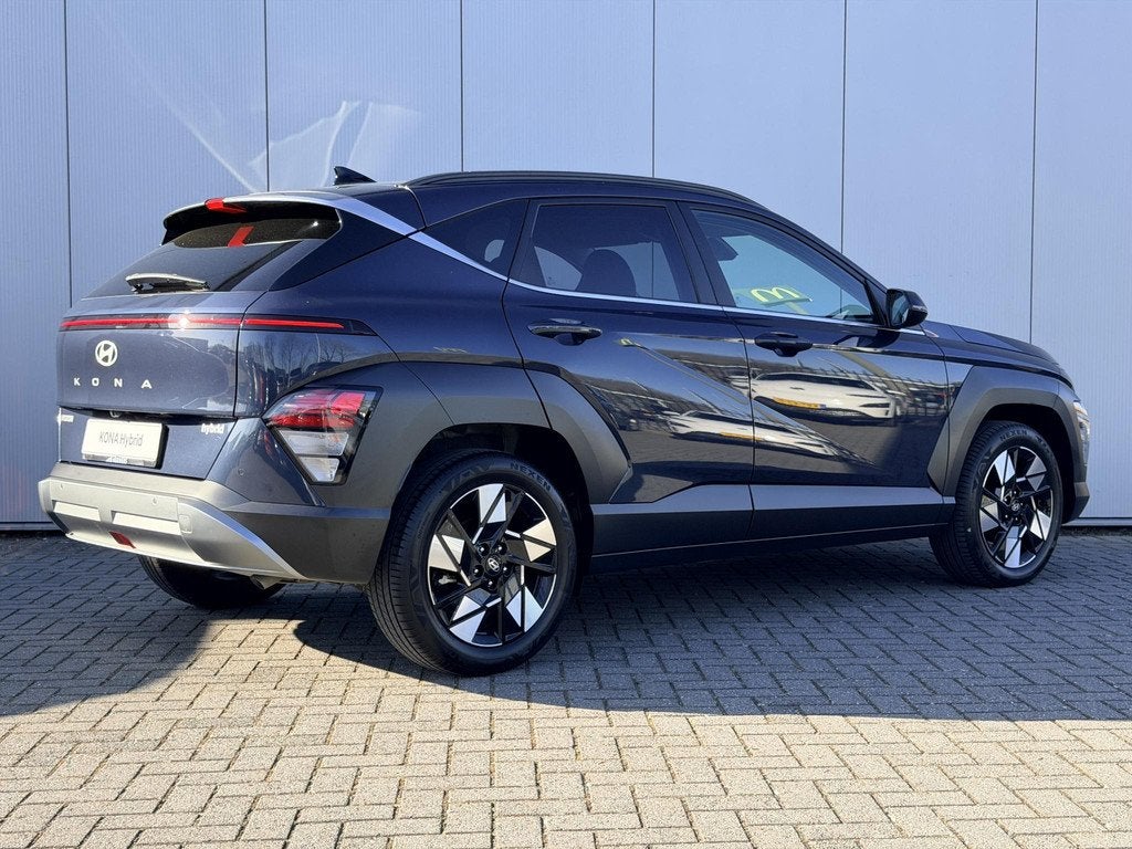 Hyundai Kona 1.6 GDI HEV Comfort Smart / Fabrieksgarantie to, Auto's, Hyundai, Stof, Gebruikt, Euro 6, Blauw