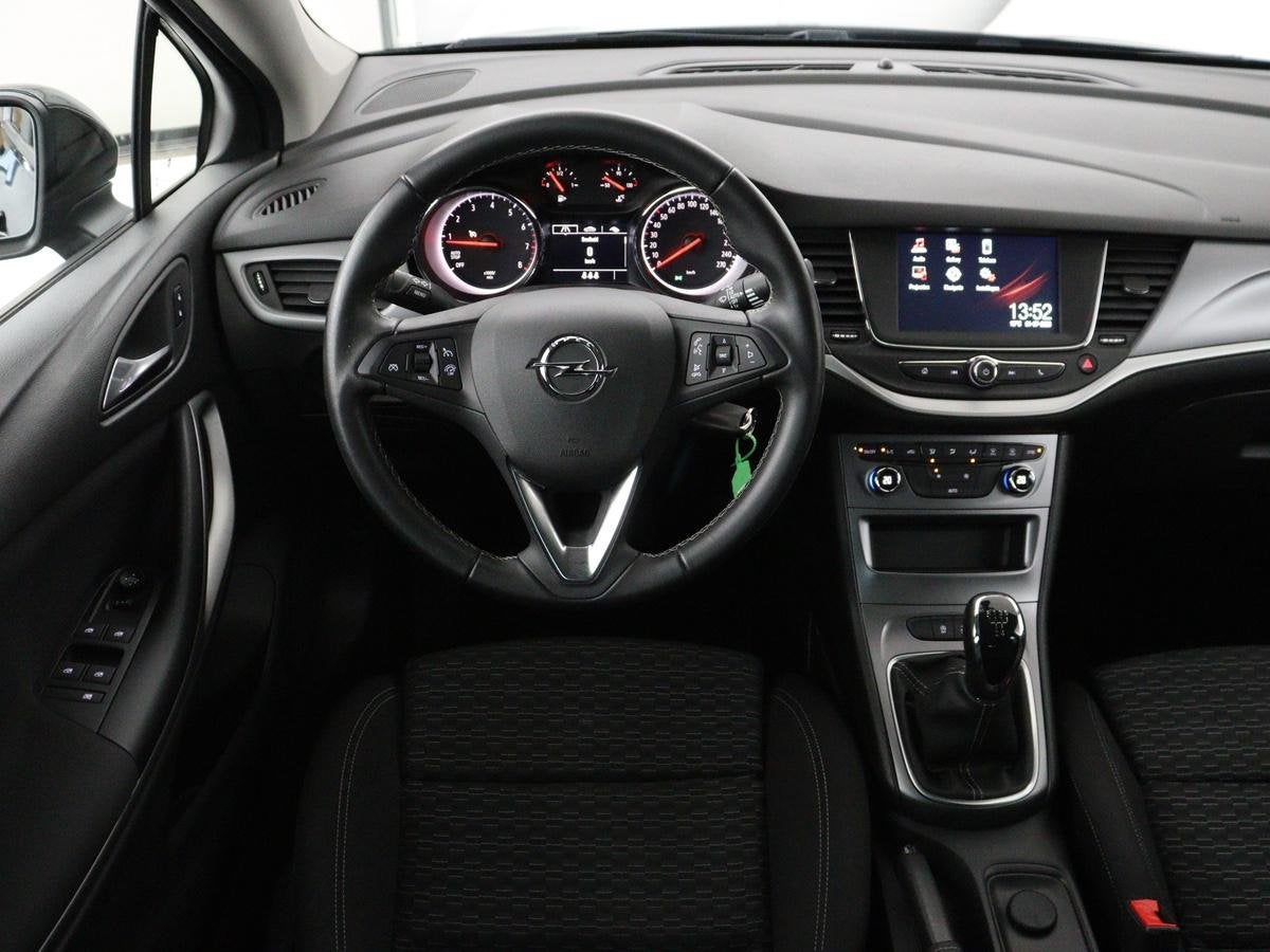 Opel Astra 1.0 Turbo 120 Jaar Edition | Carplay | DAB radio, Auto's, Stof, Gebruikt, Blauw, 610 kg