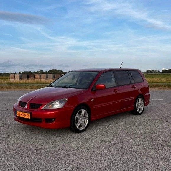 Mitsubishi Lancer 1.6 Wagon Sport 2009 Rood, Auto's, Voorwielaandrijving, Stof, 4 cilinders, 400 kg