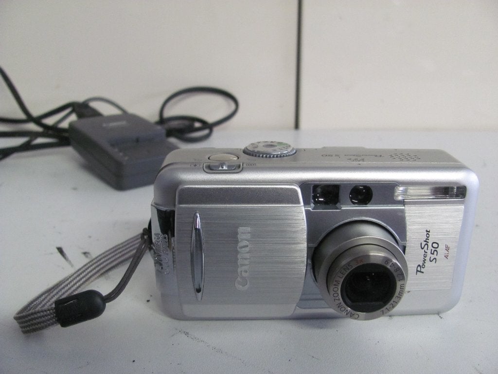 Canon PowerShot s50 aiaf  met accu en lader, Ingebouwde flitser, Accu, Canon, Ophalen of Verzenden