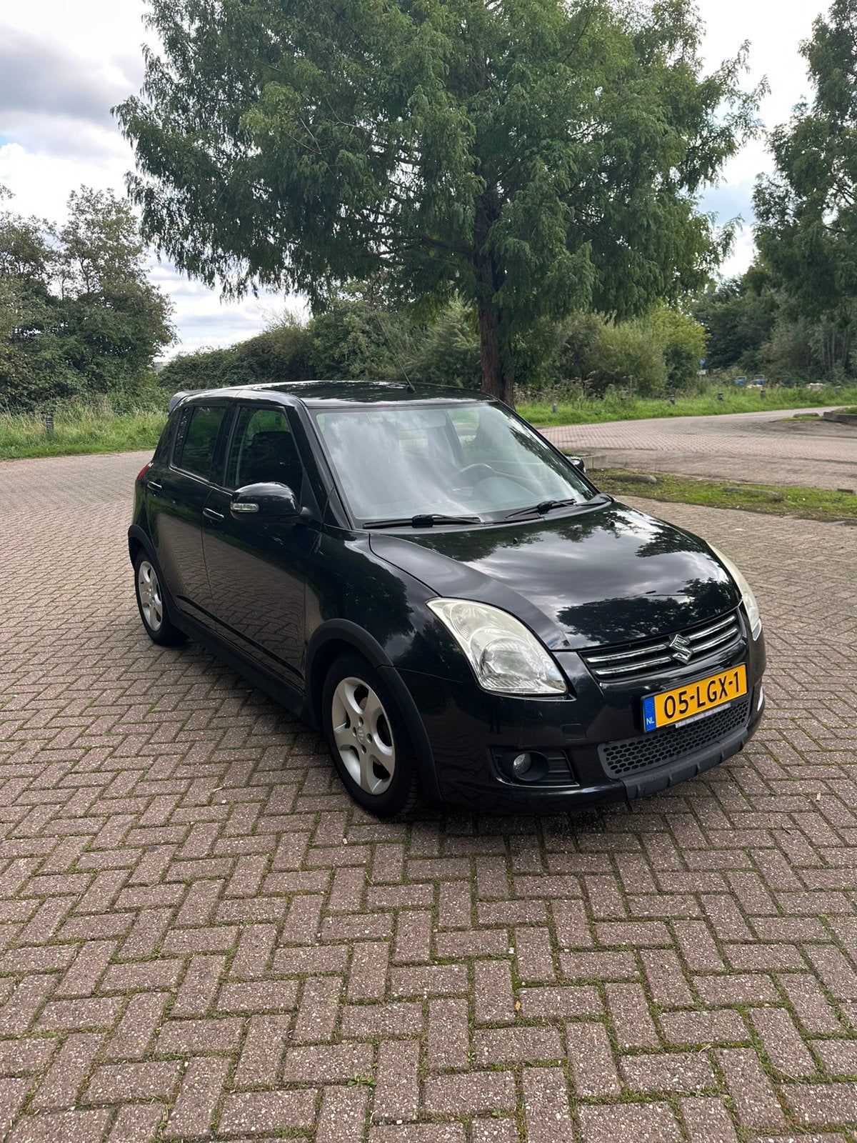 Suzuki Swift 1.3 5D 2010 Zwart, Auto's, Voorwielaandrijving, 40 €/maand, 400 kg, Origineel Nederlands