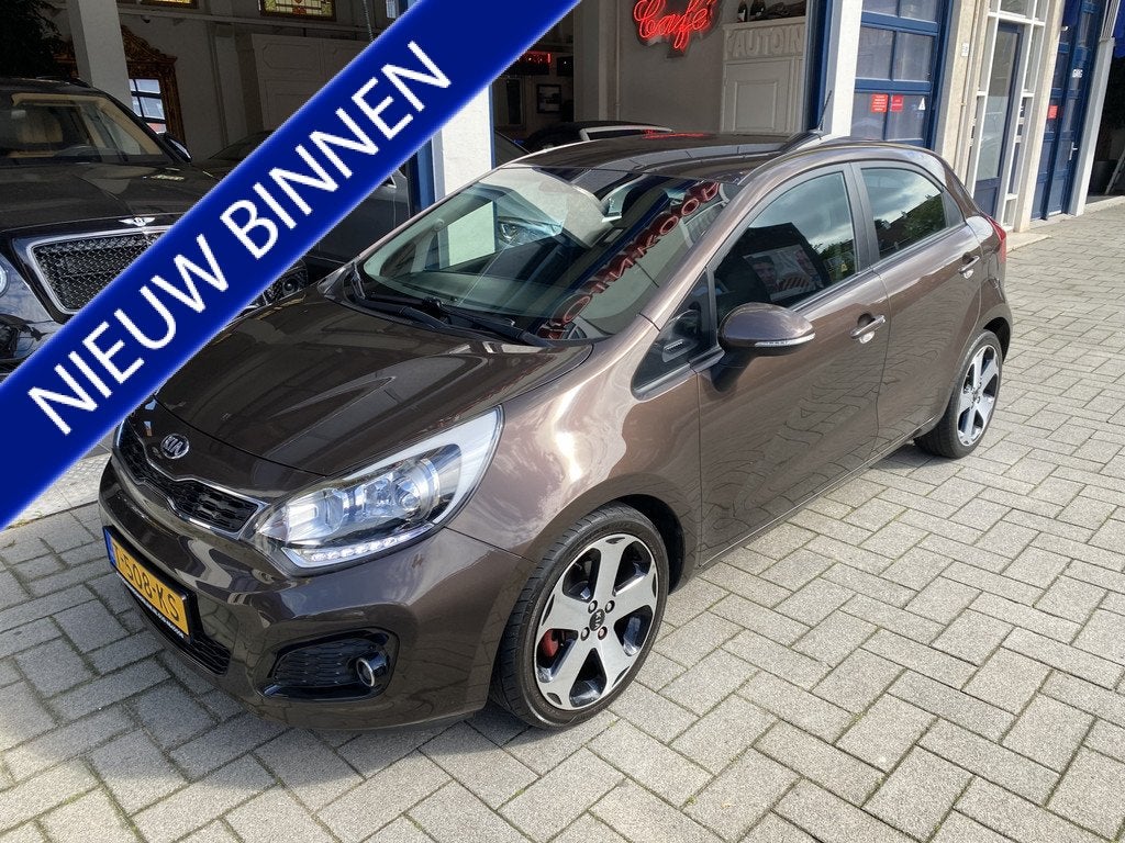 Kia Rio 1.4 CVVT Plus Pack AUTOMAAT/NAV/CLIMA/CAMERA/CRUISE, Auto's, Kia, Euro 5, 450 kg, Gebruikt, 4 cilinders