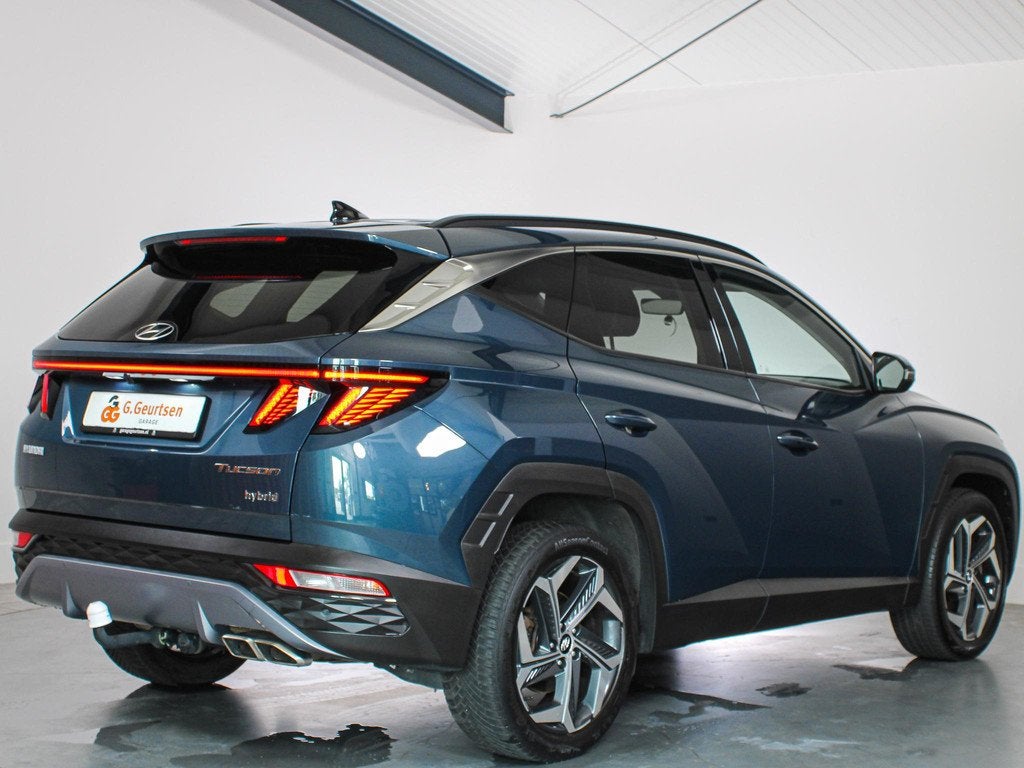 Hyundai Tucson 1.6 T-GDI HEV Premium Trekhaak, Volleder, Cam, Gebruikt, 4 cilinders, Blauw, 1650 kg