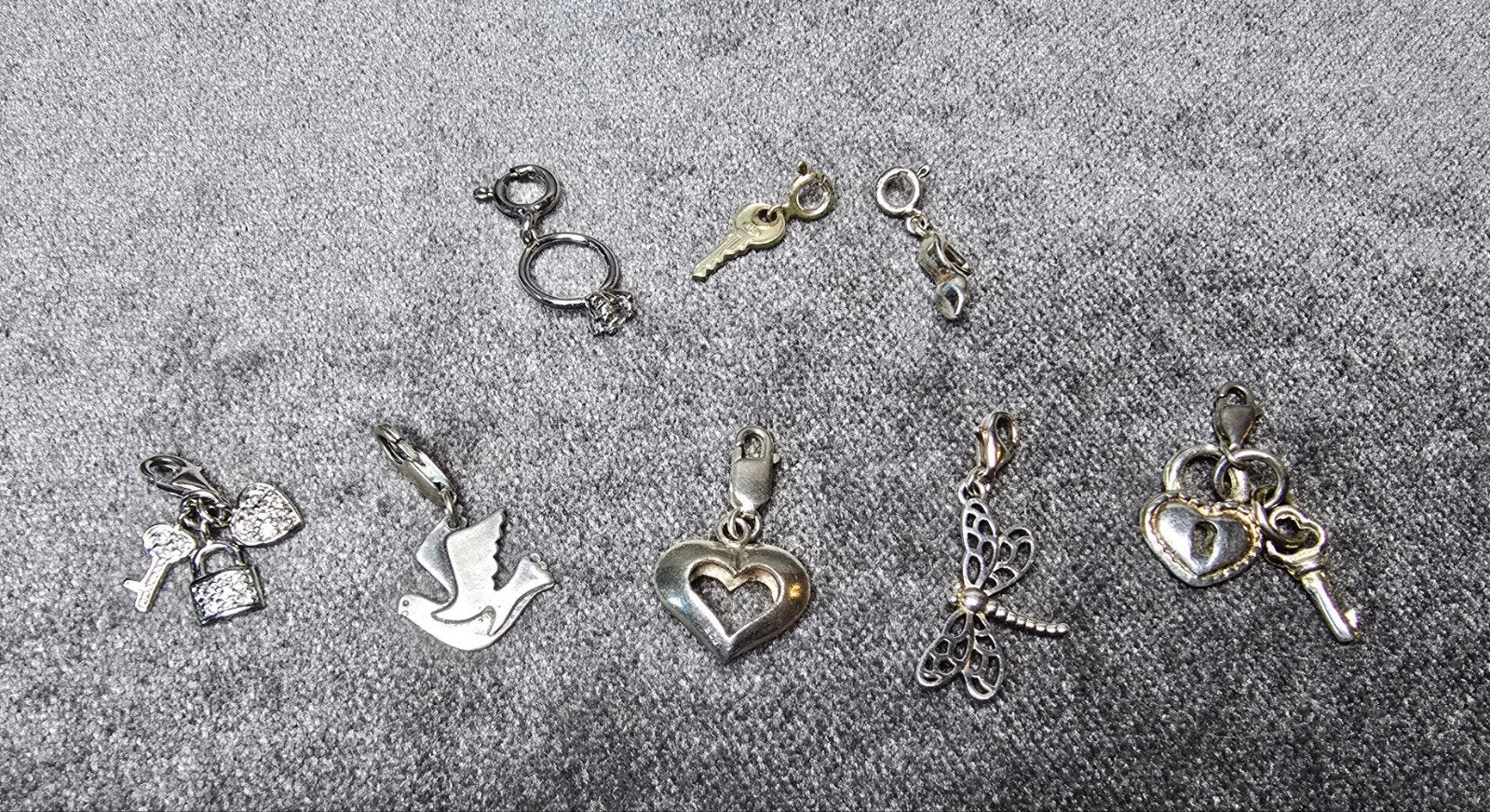 verschillende zilveren bedels met slotje, 4 bedels of meer, Ophalen of Verzenden, Zilver, Overige merken