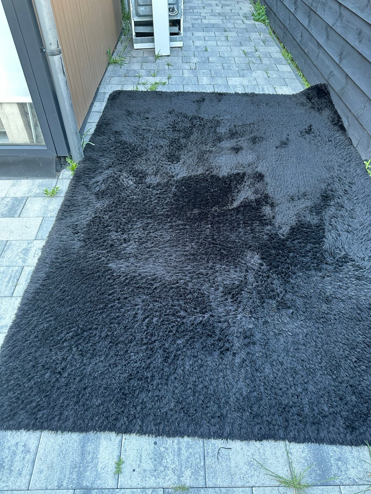 Zwart hoogpolig echt wol vloerkleed, zacht en comfortabel, Gebruikt, 100 tot 150 cm, Zwart, Ophalen of Verzenden