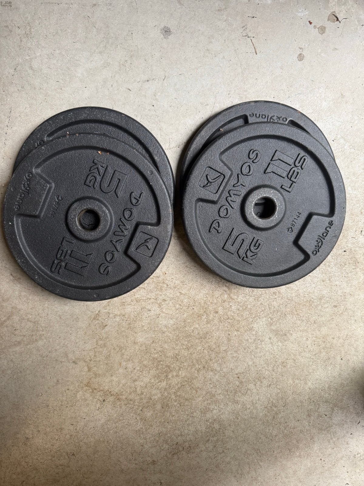 4x Domyos 5 kg halterschijven, Sport en Fitness, Ophalen of Verzenden, Gebruikt, Armen, Halterschijven