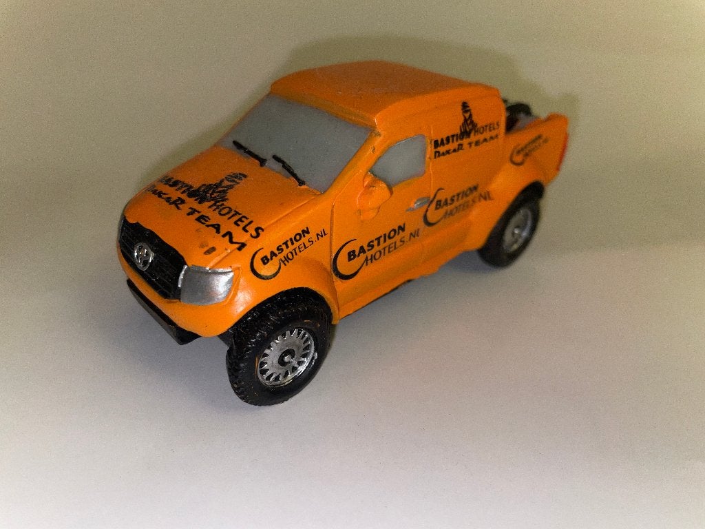 Toyota Hilux Bastion Hotels Dakar Team 1:43, Hobby en Vrije tijd, Modelauto's | 1:43, Ophalen of Verzenden, Nieuw, Auto, Overige merken