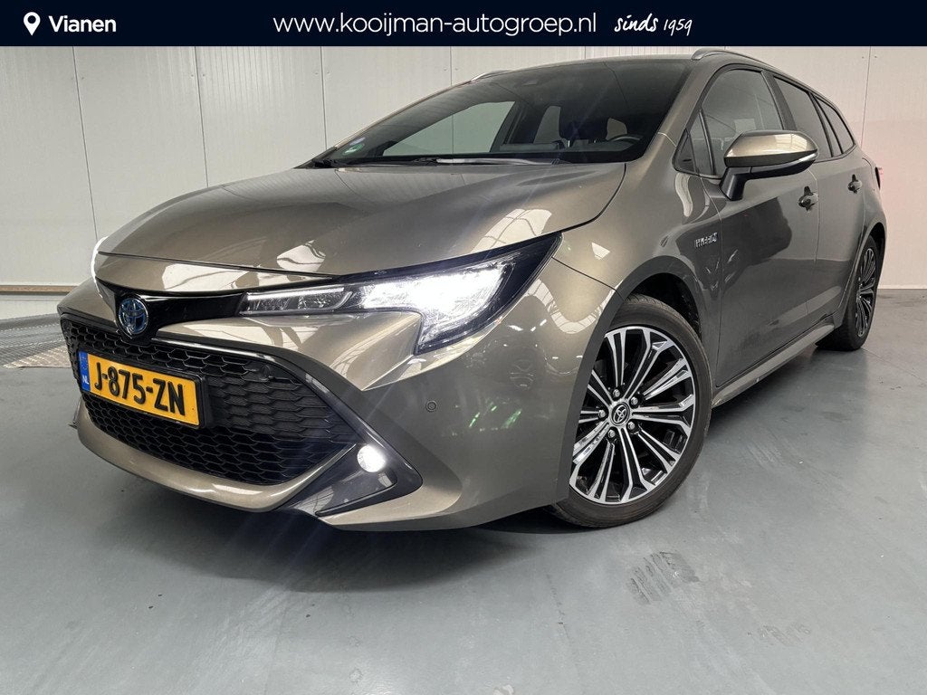 Toyota Corolla Touring Sports 1.8 Hybrid Business Plus, Auto's, Gebruikt, 4 cilinders, Corolla, 122 pk