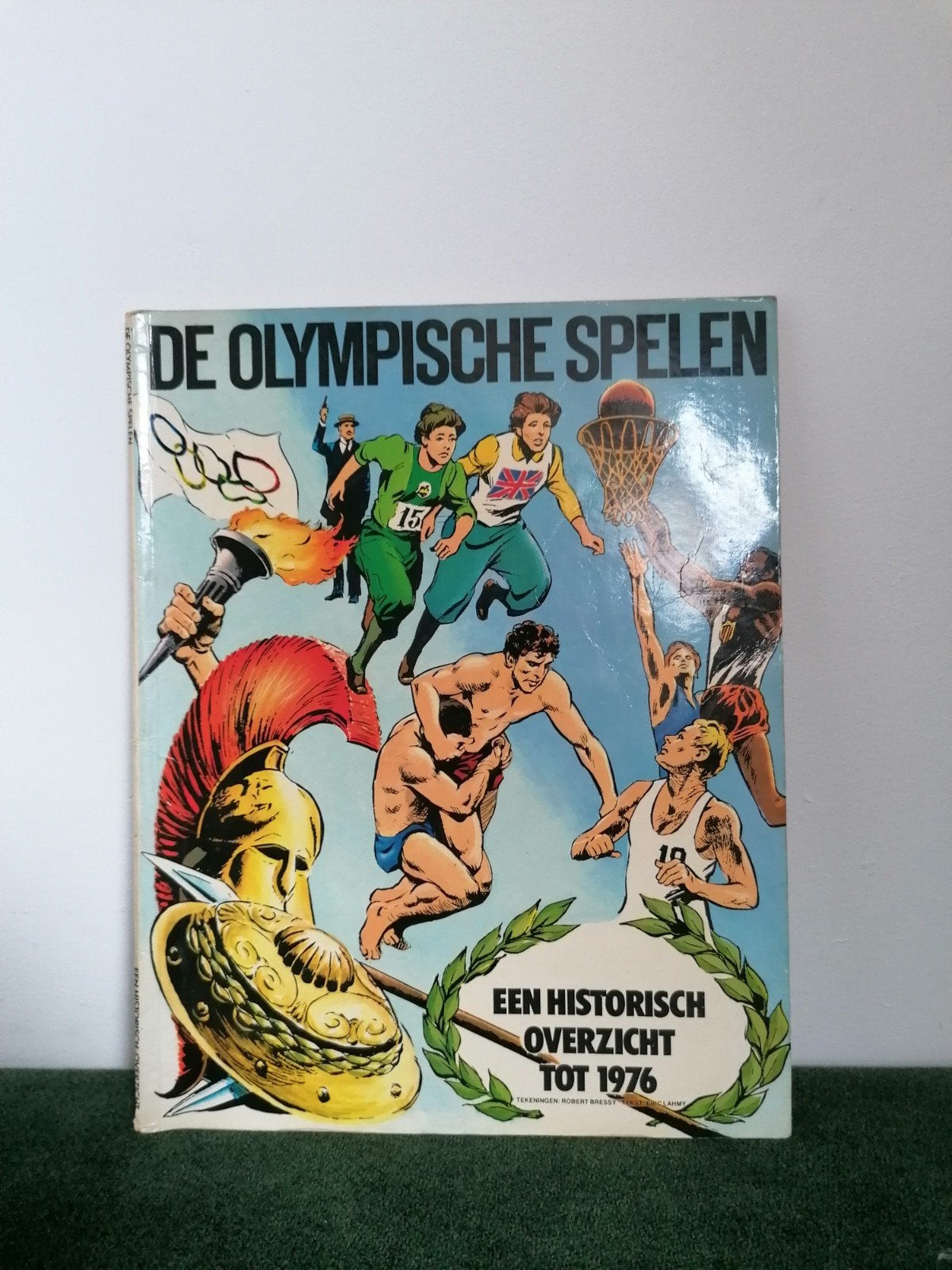De Olympische Spelen - Een historisch overzicht tot 1976, Boeken, Gelezen, Eén stripboek, Robert Bressy - Eric Lahmy, Ophalen of Verzenden