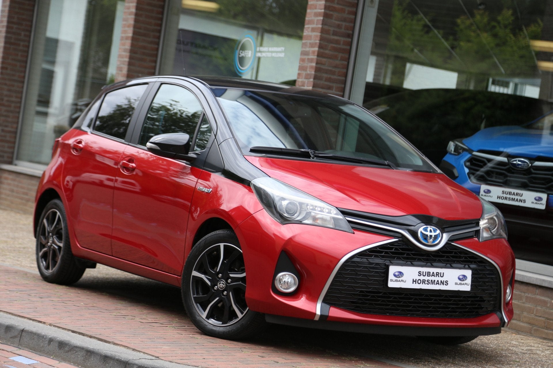 Toyota Yaris 1.5 Hybrid Dynamic Bi-Tone Navi Camera, Auto's, 12 maanden, Gebruikt, 4 cilinders, 1070 kg
