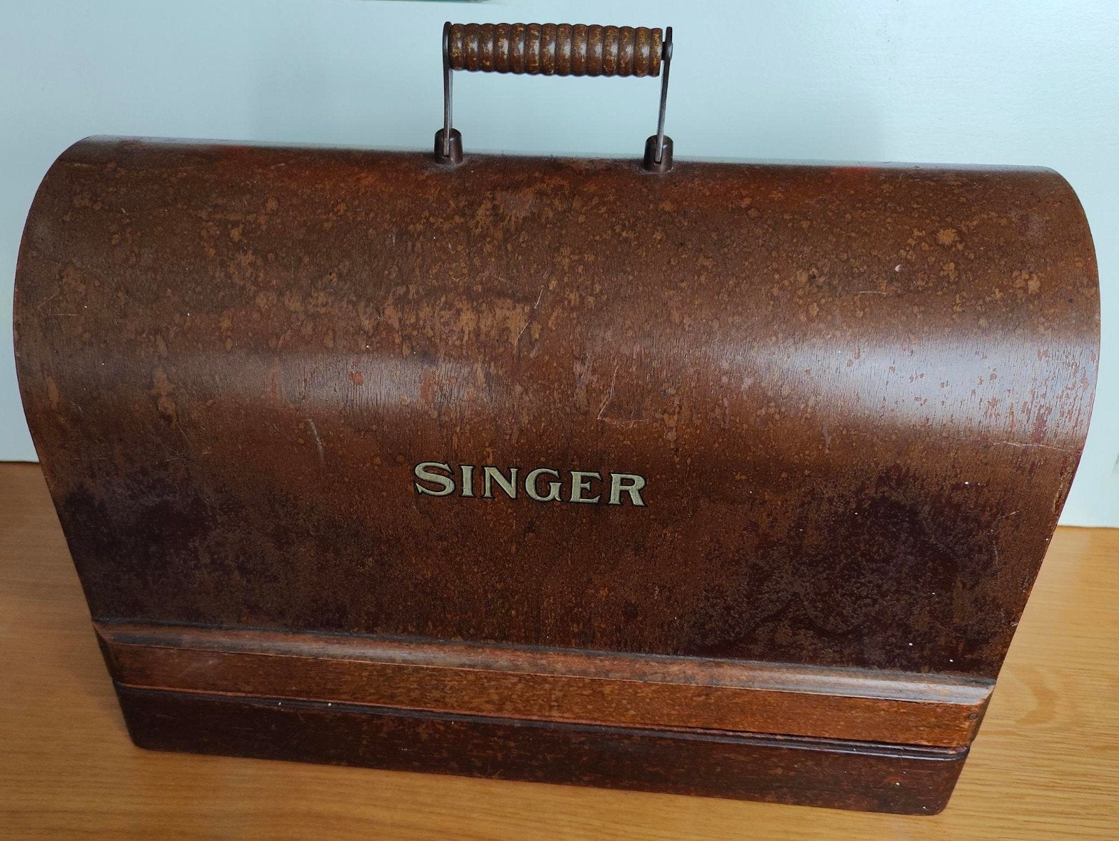 Singer hand- naaimachine met kap, Ophalen