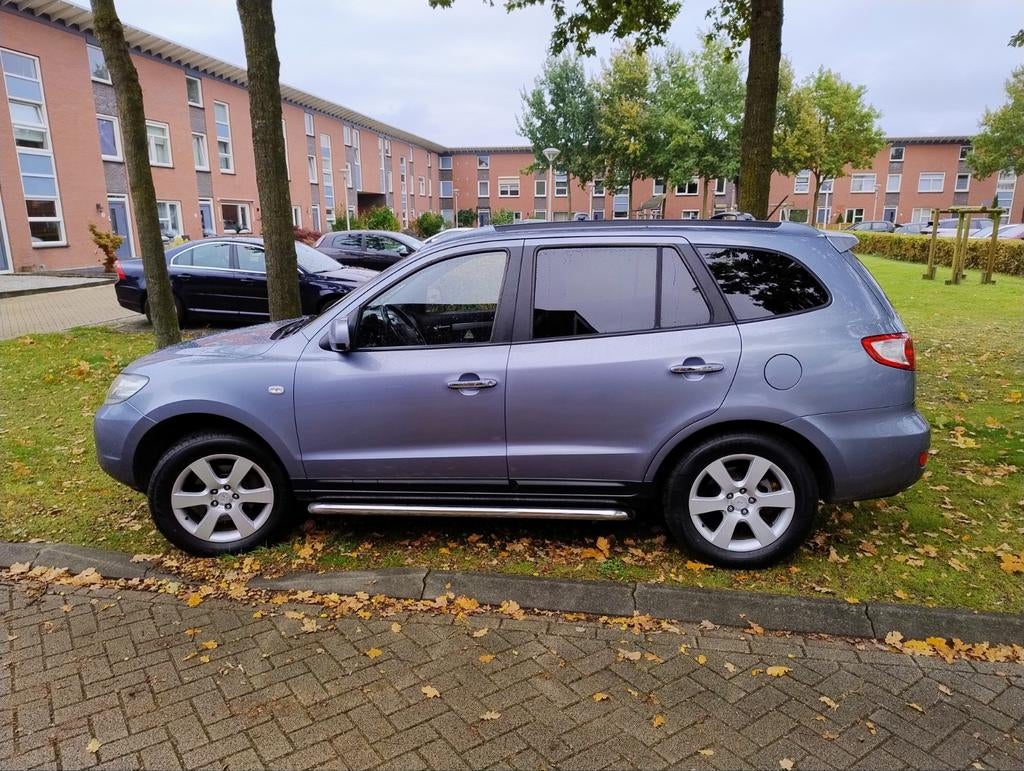 Hyundai Santa Fe 2.7 2WD 2009 Blauw NL 5 persoons, Auto's, Hyundai, Voorwielaandrijving, Zwart, 2000 kg, Blauw
