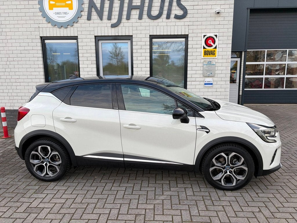 Renault Captur 1.6 E-Tech Plug-in Hybrid 160 Business / Trek, Auto's, Renault, 77 km/l, Gebruikt, Leder en Stof, Wit