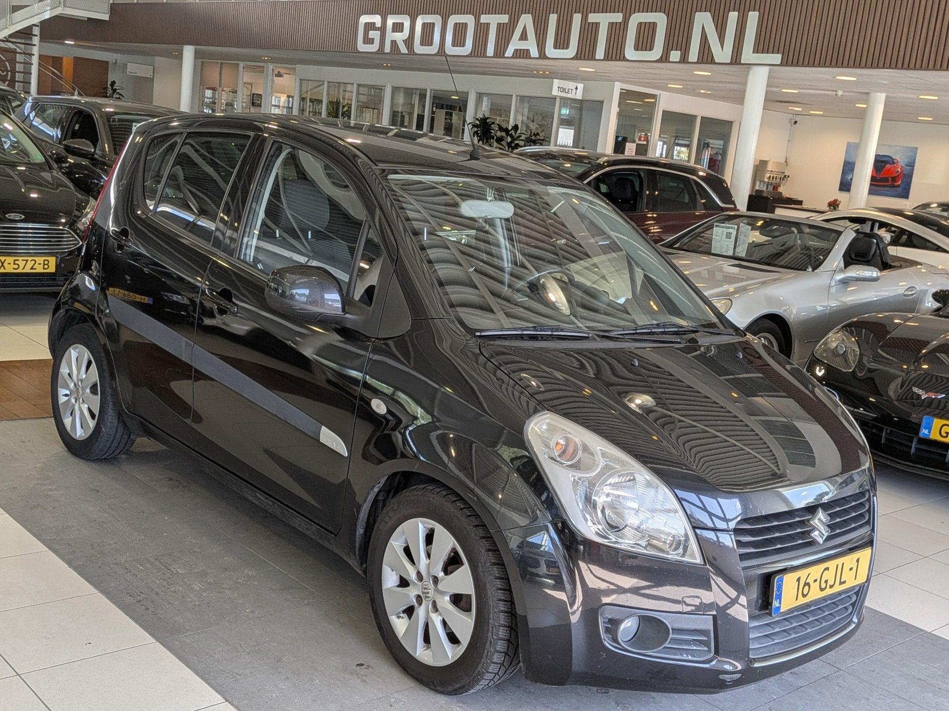 Suzuki Splash 1.2 Exclusive Automaat Airco, Stuurbekrachtigi, Auto's, 4 cilinders, Zwart, Origineel Nederlands, Bedrijf