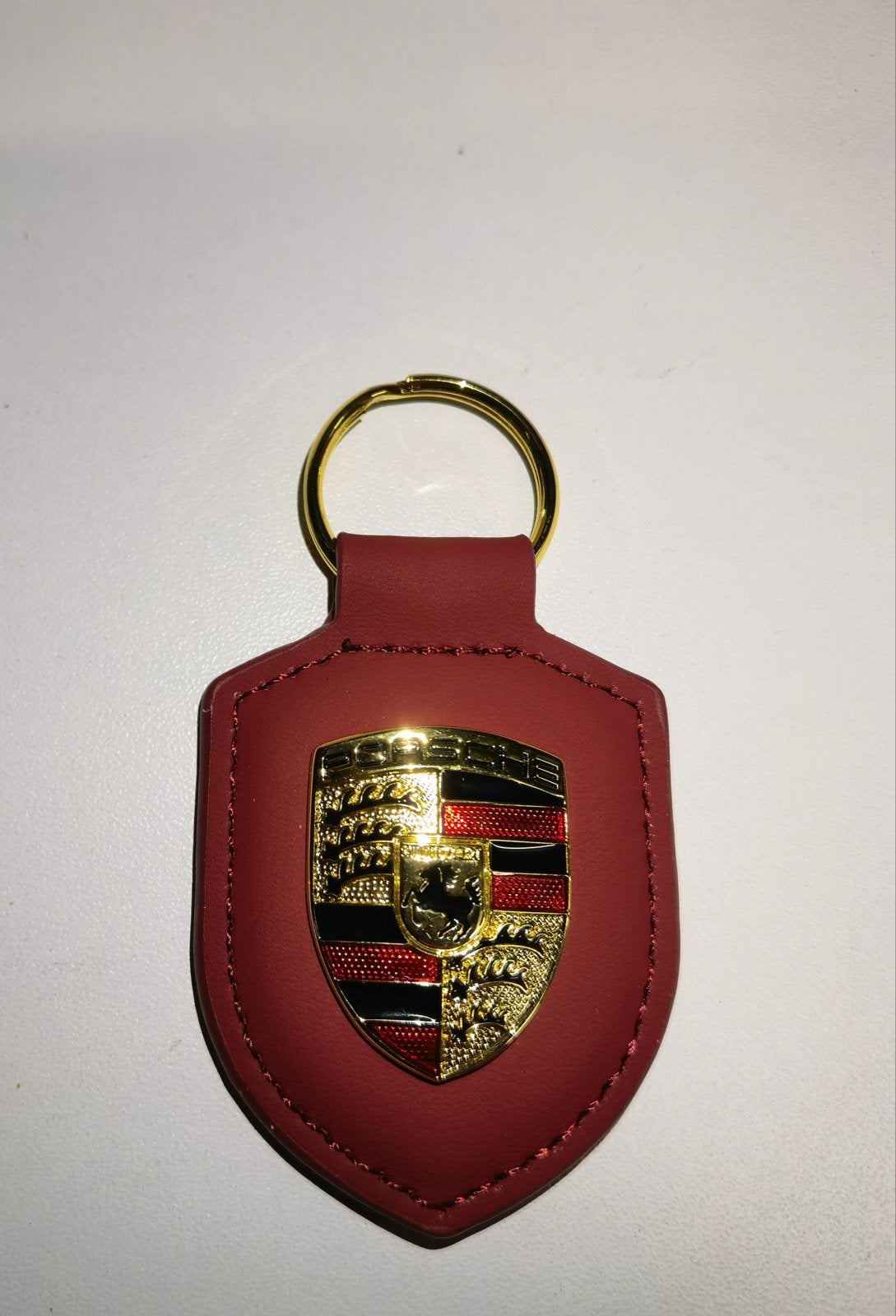 Porsche Sleutelhanger - bordeaux/rood wijn kleurig, Verzamelen, Sleutelhangers, Ophalen of Verzenden, Nieuw, Merk