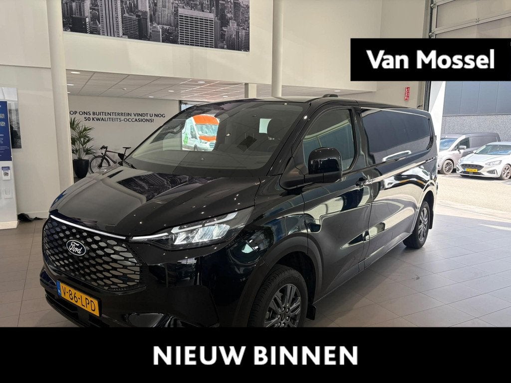 Ford E-Transit Cust. 320 L2H1 Limited 65 kWh CAMERA | APPLE, Automaat, Gebruikt, Met garantie (alle), 2192 kg
