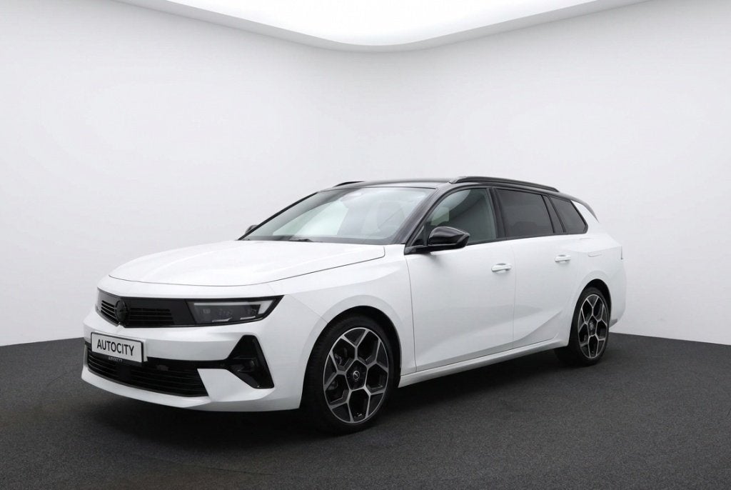 Opel Astra Sports Tourer 1.6 Turbo GS PHEV Panoramadak | Mat, Auto's, Gebruikt, 4 cilinders, Wit, Hybride Elektrisch/Benzine