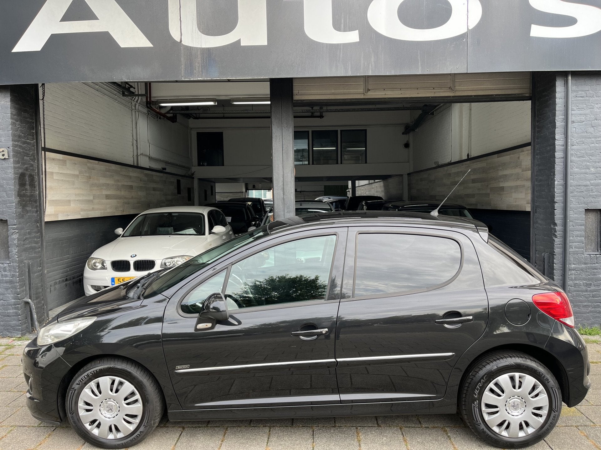 Peugeot 207 1.4 VTi Sportium l airco l (bj 2011), Voorwielaandrijving, Euro 5, Stof, Gebruikt