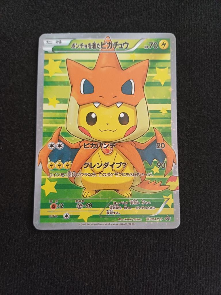 Pokémon Poncho-wearing Pikachu Charizard Y, Hobby en Vrije tijd, Verzamelkaartspellen | Pokémon, Ophalen of Verzenden, Losse kaart