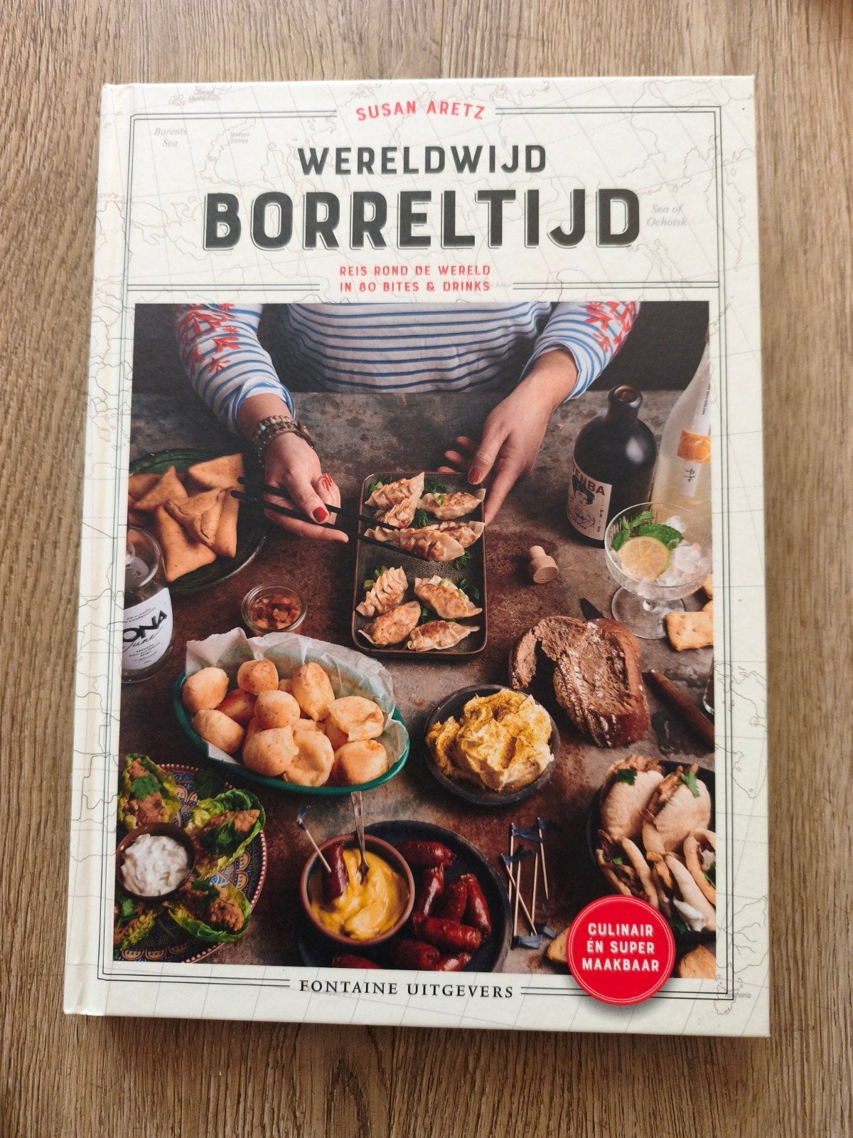 Wereldwijd Borreltijd: Reis rond de wereld in 80 bites, Boeken, Overige typen, Ophalen of Verzenden, Zo goed als nieuw, Susan Aretz