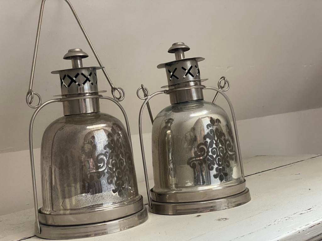 Set windlichten van armeluiszilver, Ophalen