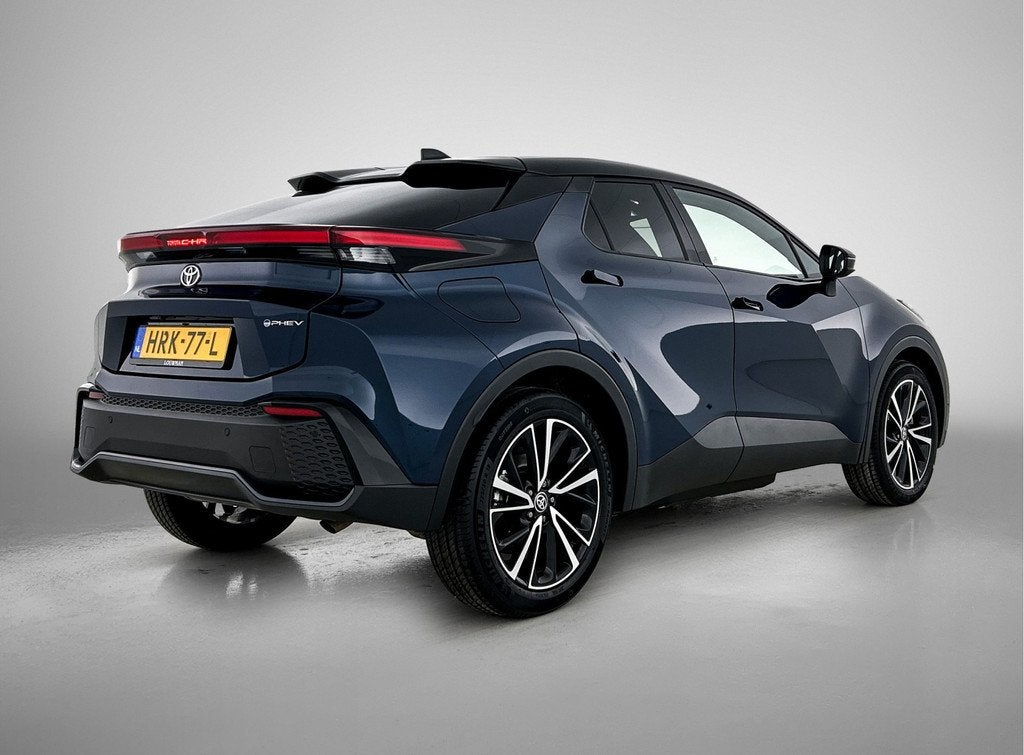 Toyota C-HR 2.0 Plug-in Hybrid 220 Executive | Navigatie | J, Auto's, Toyota, 12 maanden, 4 cilinders, Blauw, Leder en Stof