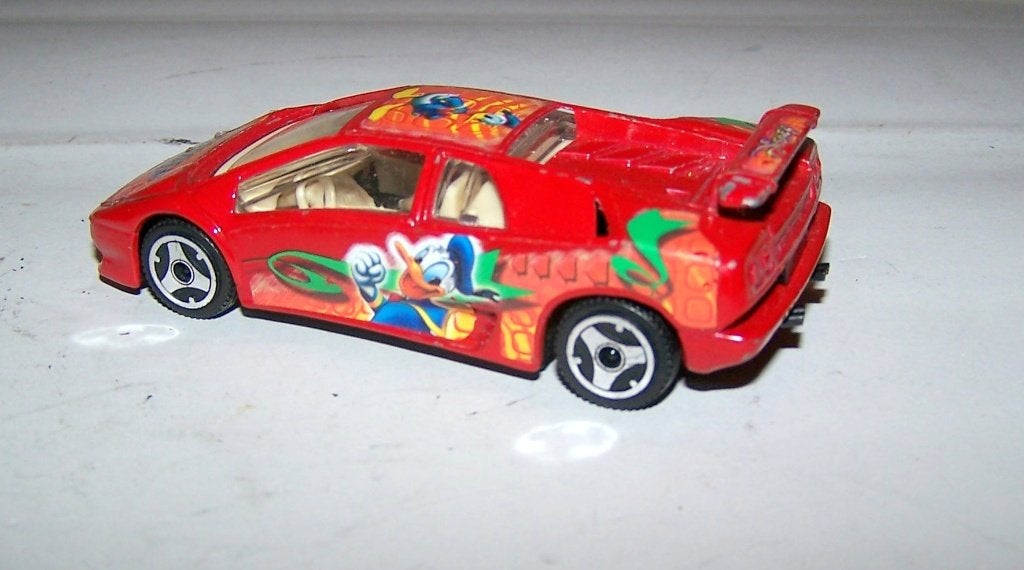 Lamborghini Diablo Donald Duck. Bburago 1/43. Izgs., Ophalen of Verzenden, Zo goed als nieuw, Auto, Overige merken