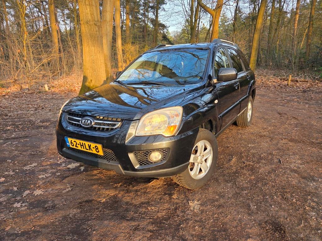 Kia Sportage 2.0 2WD 2009 Zwart, Auto's, Kia, 1442 kg, Stoelverwarming, Zwart, 4 cilinders