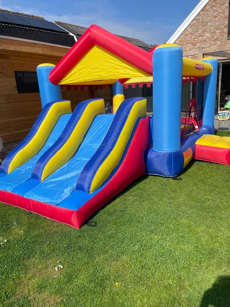 Springkussen 5x4 met glijbaan huren in Noord Holland, Ophalen, Zo goed als nieuw