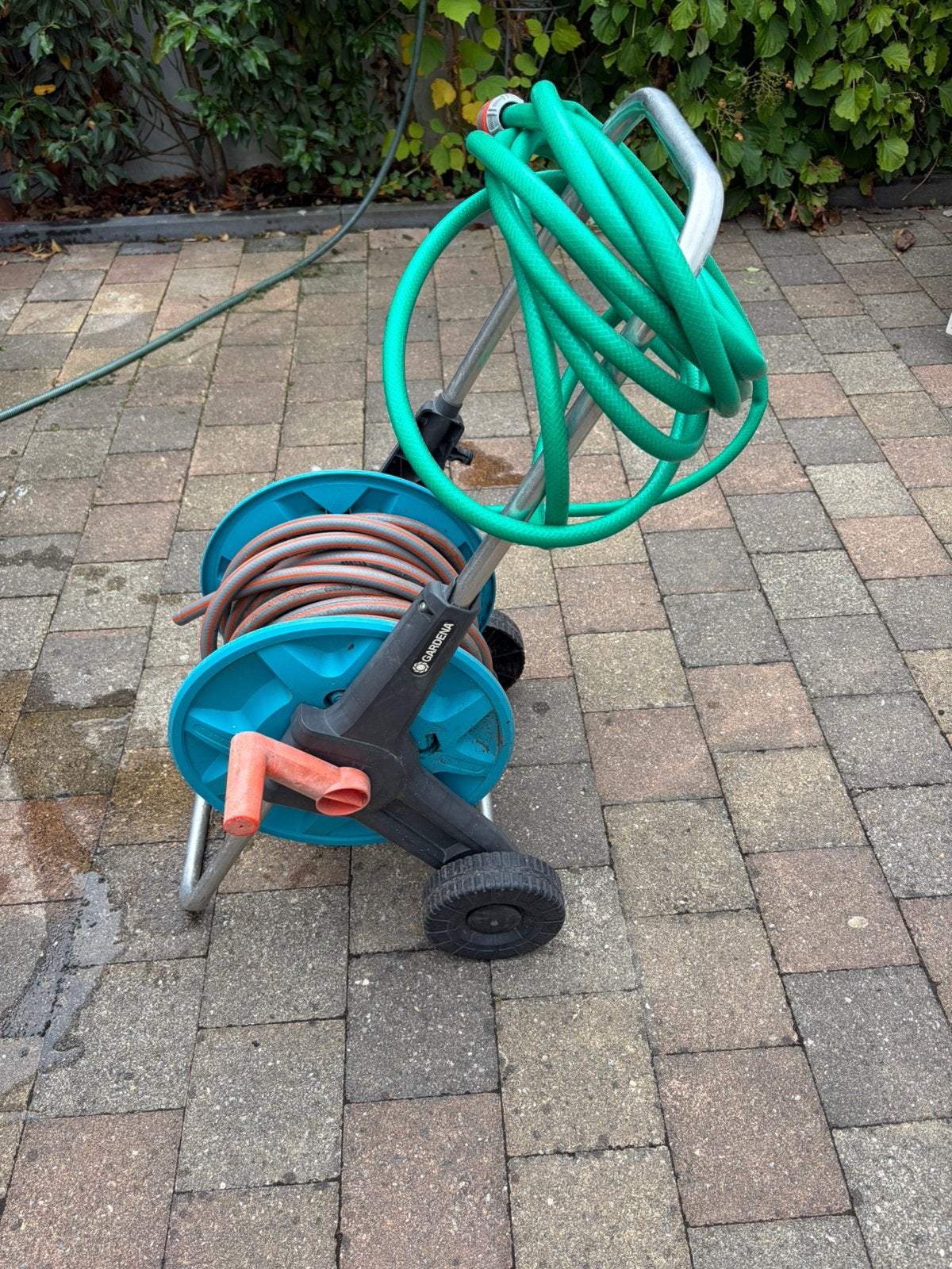 Gardena tuinslang op haspel en gardena grasmaaier, Ophalen, Zo goed als nieuw, Tuinslang