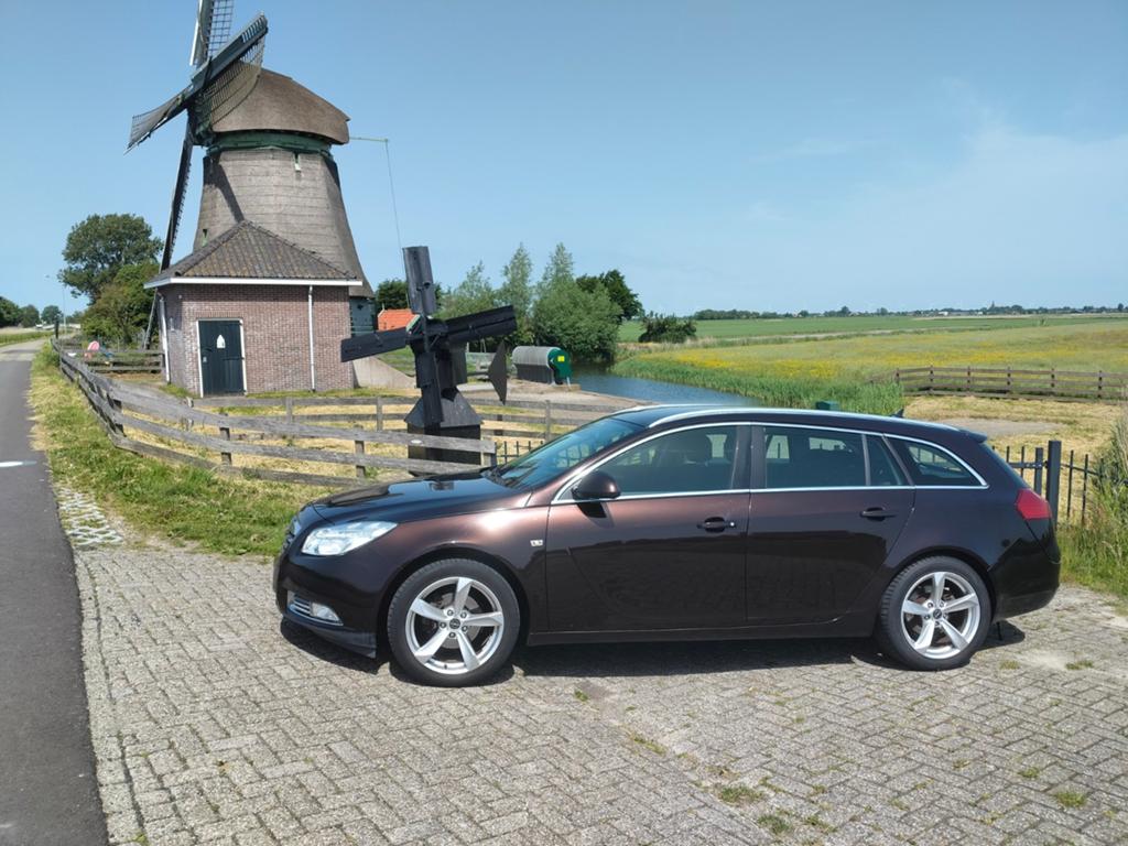 Opel Insignia 1.4 Turbo 103KW Sports Tourer 2011 Bruin, Auto's, 4 cilinders, Bruin, Origineel Nederlands, Handgeschakeld