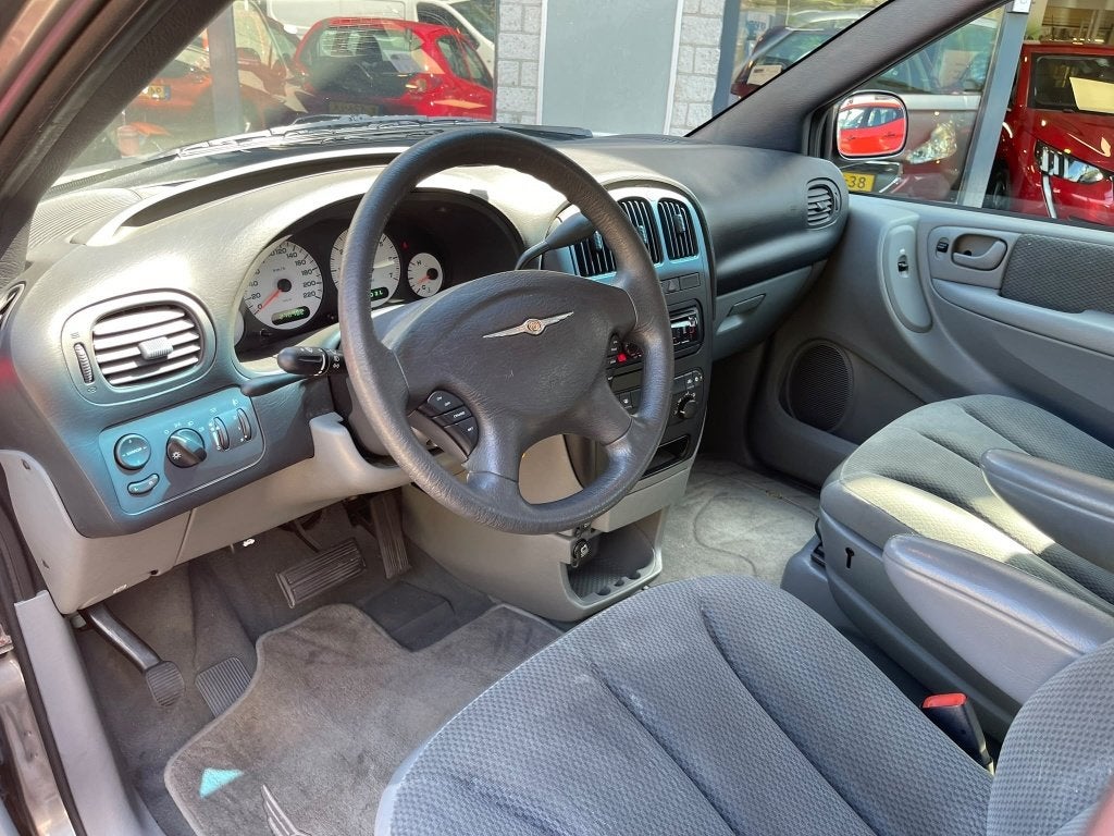 Chrysler Grand Voyager 3.3i V6 SE Luxe Trekhaak DVD 7Pers, Auto's, Automaat, 3301 cc, 450 kg, Gebruikt