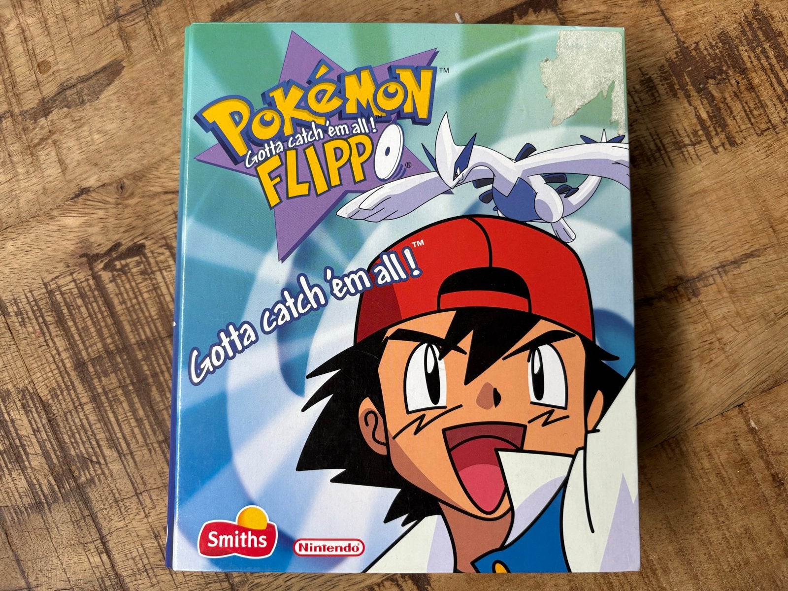 Pokémon Flippo map met 70 flippo's en 4 slammers, Ophalen of Verzenden, Verzameling, Met verzamelmap(pen)