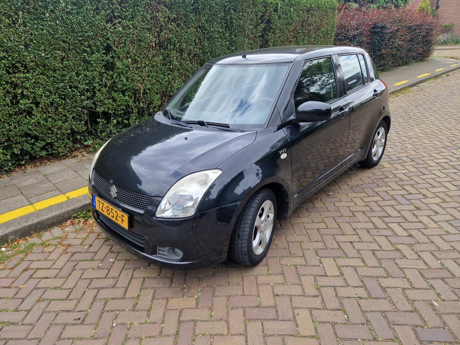 Suzuki Swift 1.5 VVT 2005 Zwart g.o.h. Apk april 2027, Auto's, Suzuki, Voorwielaandrijving, Stof, 40 €/maand, Zwart