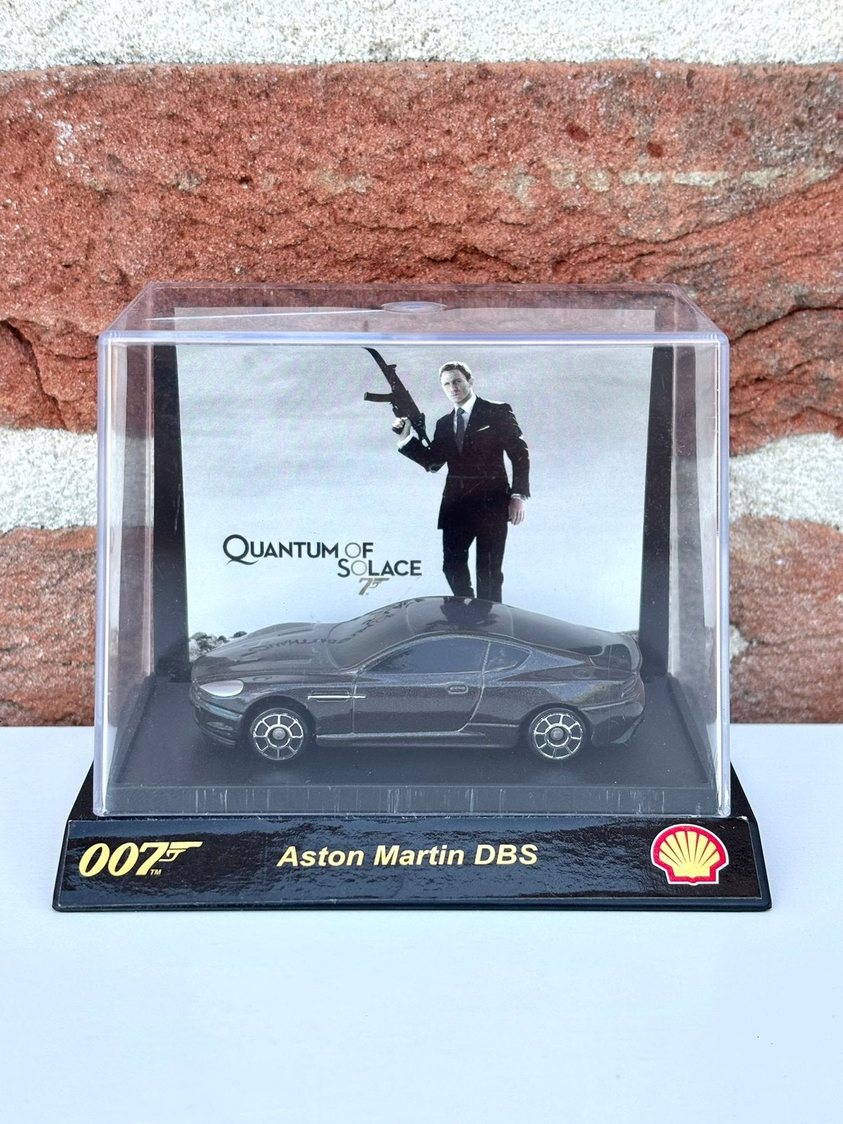 James Bond Aston Martin DBS Shell Special Edition 1:64, Hobby en Vrije tijd, Modelauto's | Overige schalen, Ophalen of Verzenden