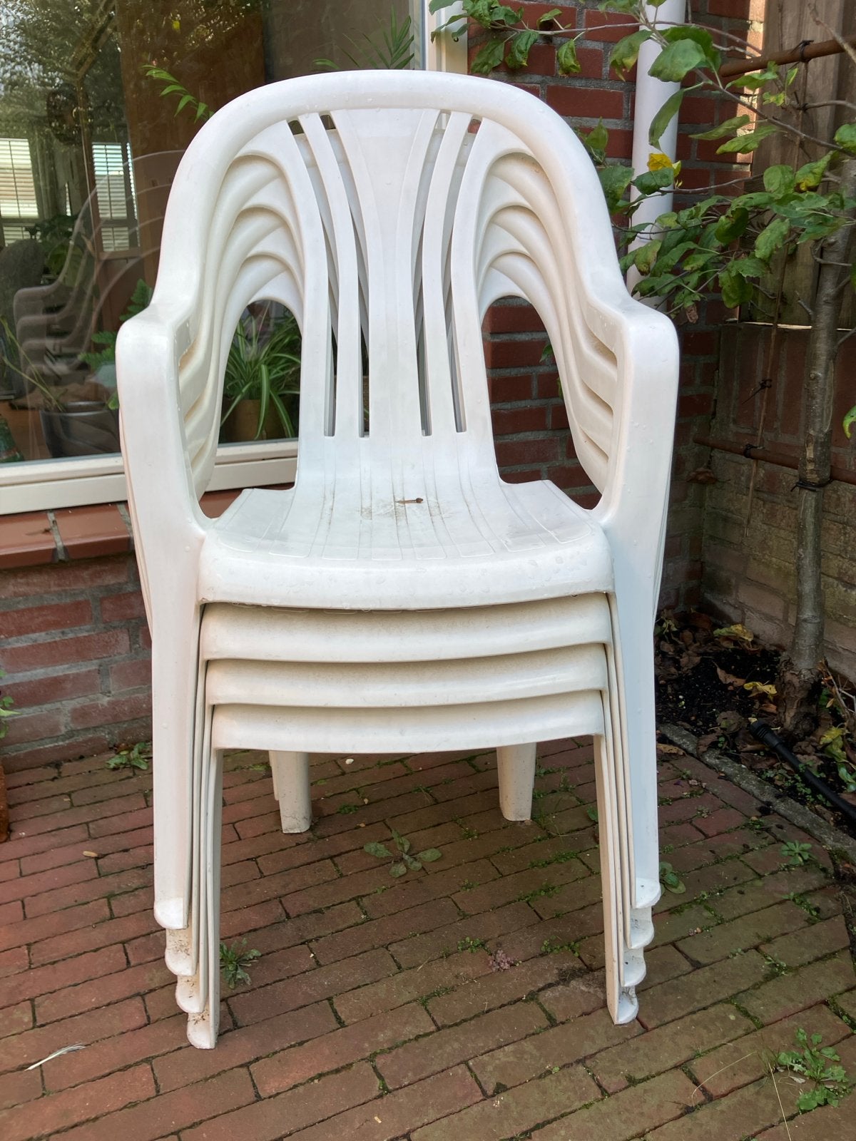 Set van 4 stapelbare tuinstoelen van kunststof, Ophalen of Verzenden, Gebruikt, Kunststof, Stapelbaar