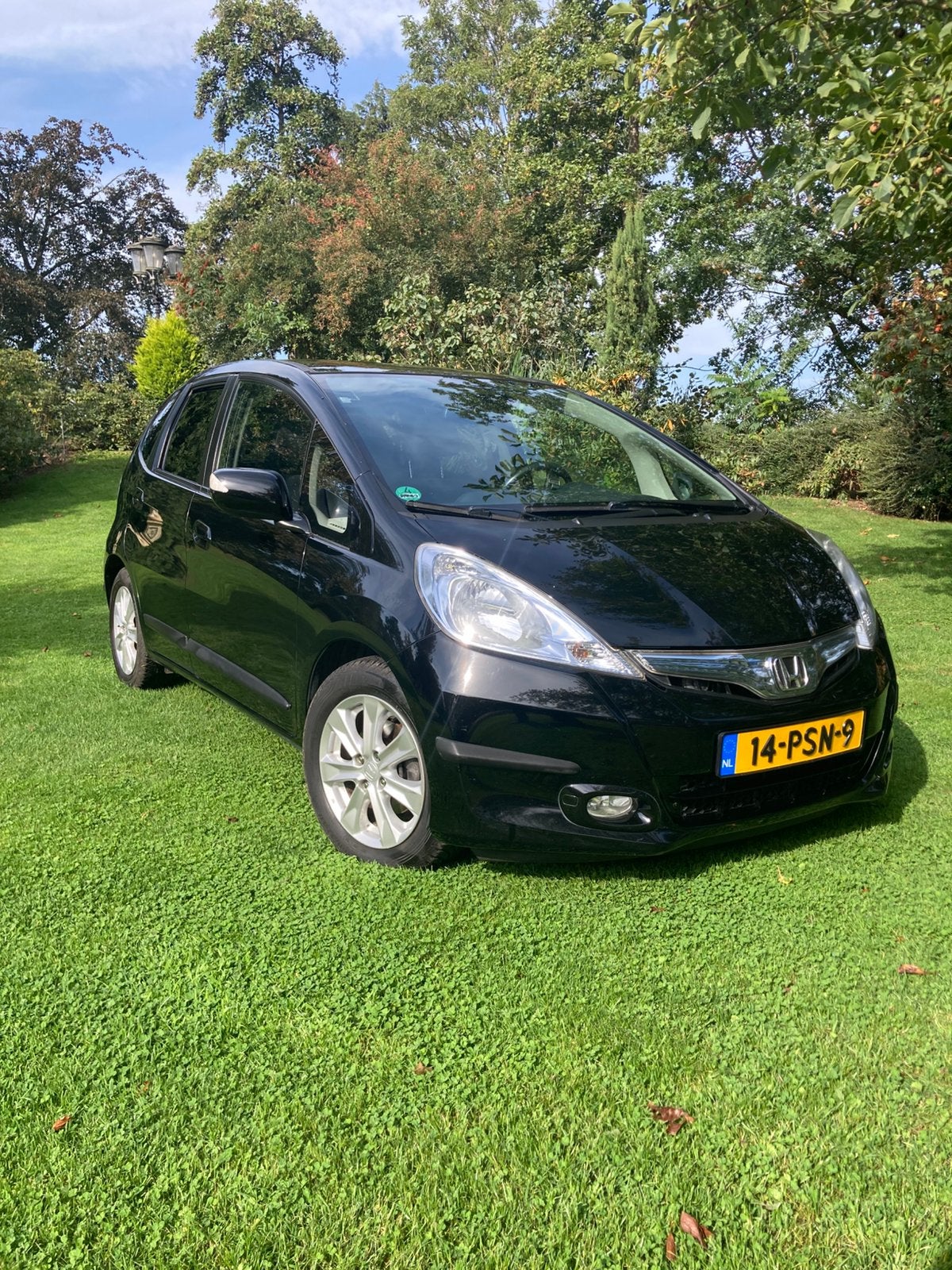 Honda Jazz Hybrid 1e eigenaar nwe 4 seizoenenbanden., Auto's, Euro 5, Zwart, 4 cilinders, Zwart