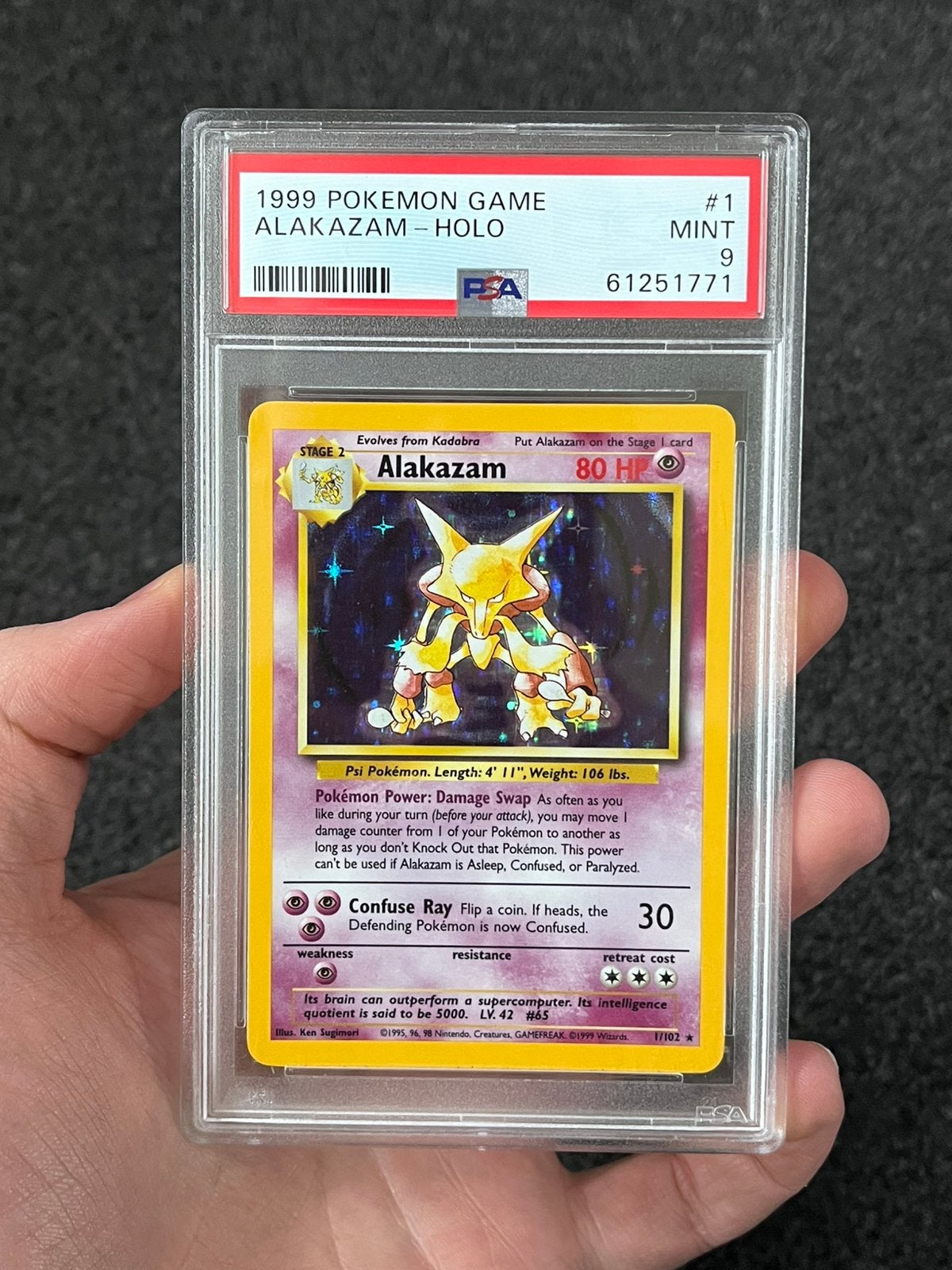 Pokémon PSA 9 Alakazam Holo #1 Base set, Ophalen of Verzenden, Zo goed als nieuw, Losse kaart, Foil