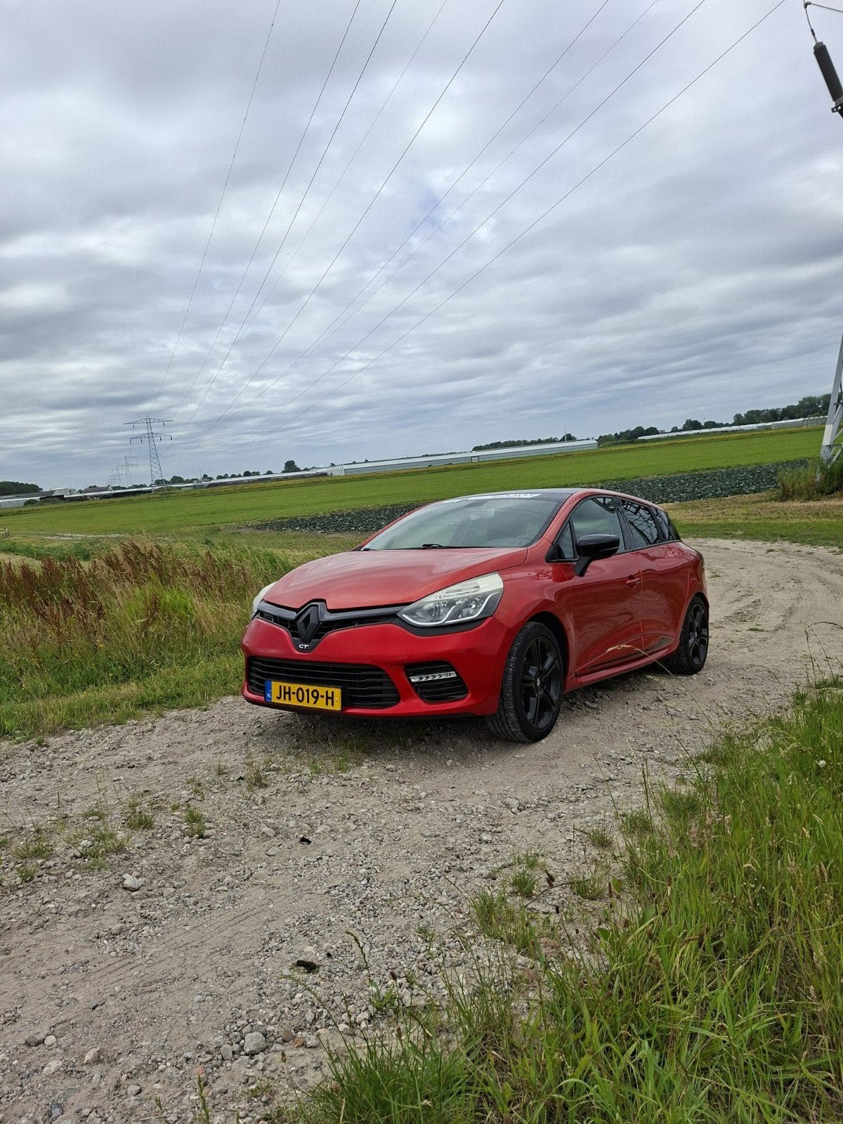 Renault Clio 1.2 TCE 87KW Estate EDC 2016 Rood, Auto's, Renault, 1139 kg, 118 pk, 4 cilinders, 49 €/maand