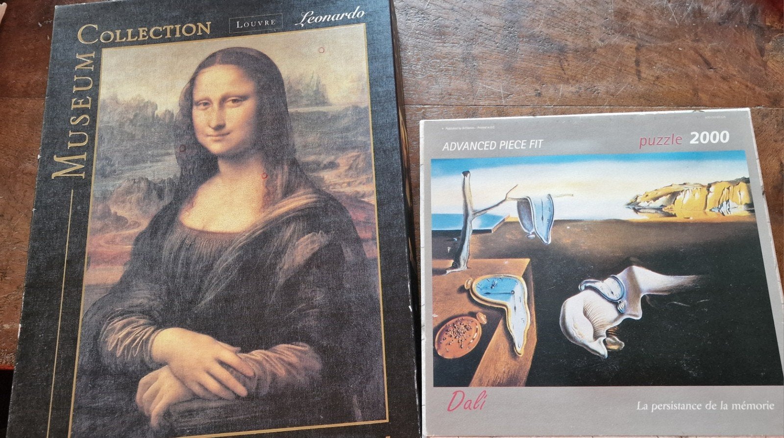2 Puzzels: Mona Lisa (1000) & Dali (2000), Ophalen of Verzenden, Meer dan 1500 stukjes, Gebruikt, Legpuzzel